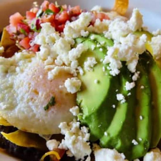 Order Huevos Rancheros food online from Famous Toastery Lake Wylie store, Lake Wylie on bringmethat.com