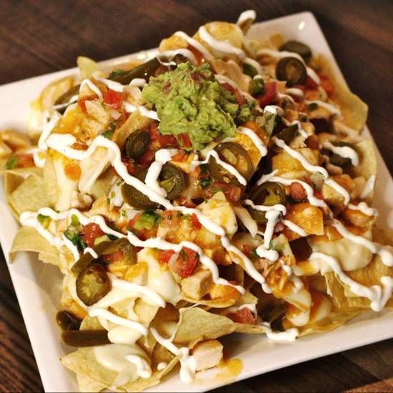 Order The Nacho food online from The Bar at Tropicana and Durango store, Las Vegas on bringmethat.com