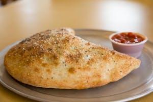 Order Meatball Calzone food online from Massino's Pizzeria store, Aurora on bringmethat.com