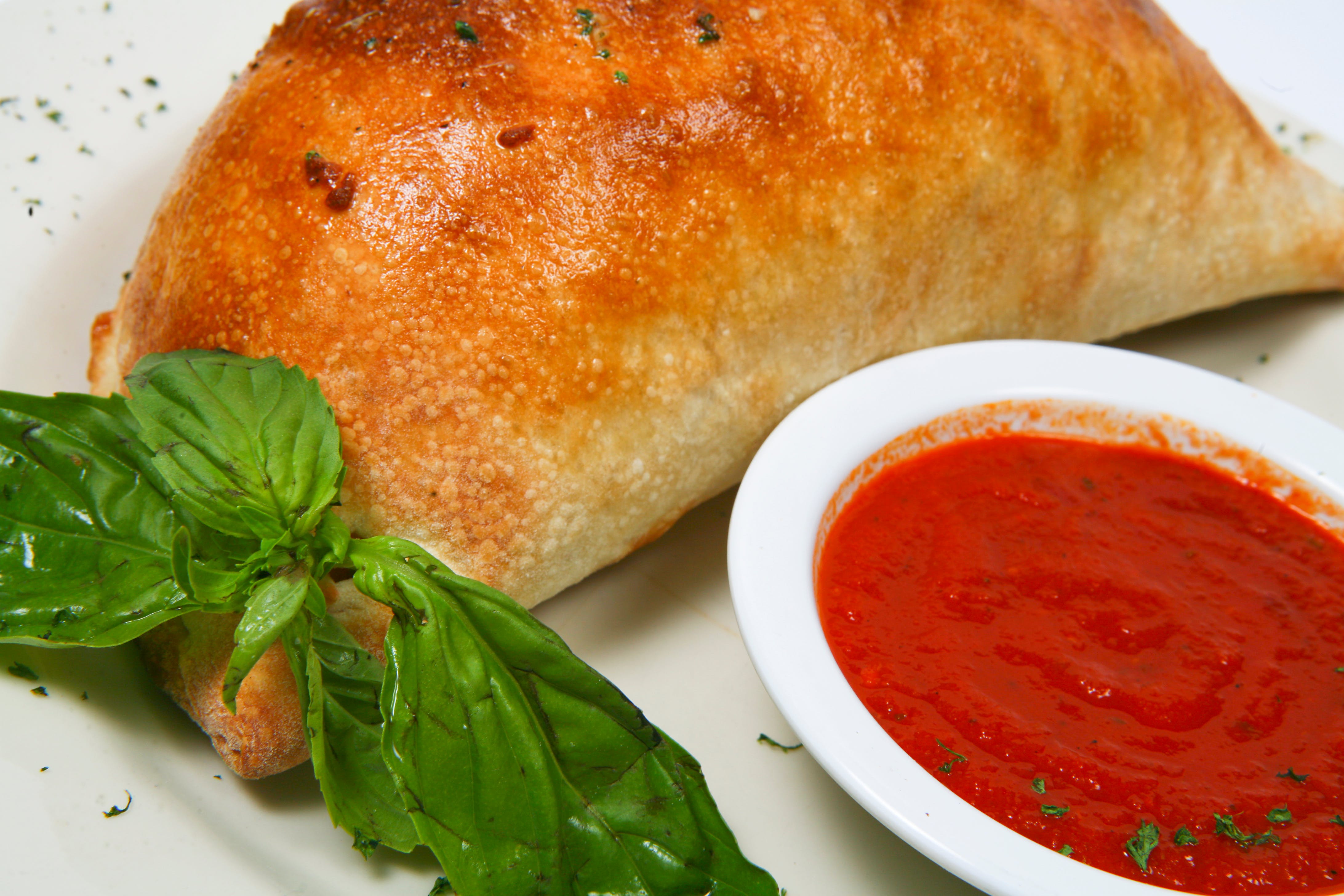 Order Supreme Calzone - Calzone food online from Napoli Pizza & Pasta store, Houston on bringmethat.com