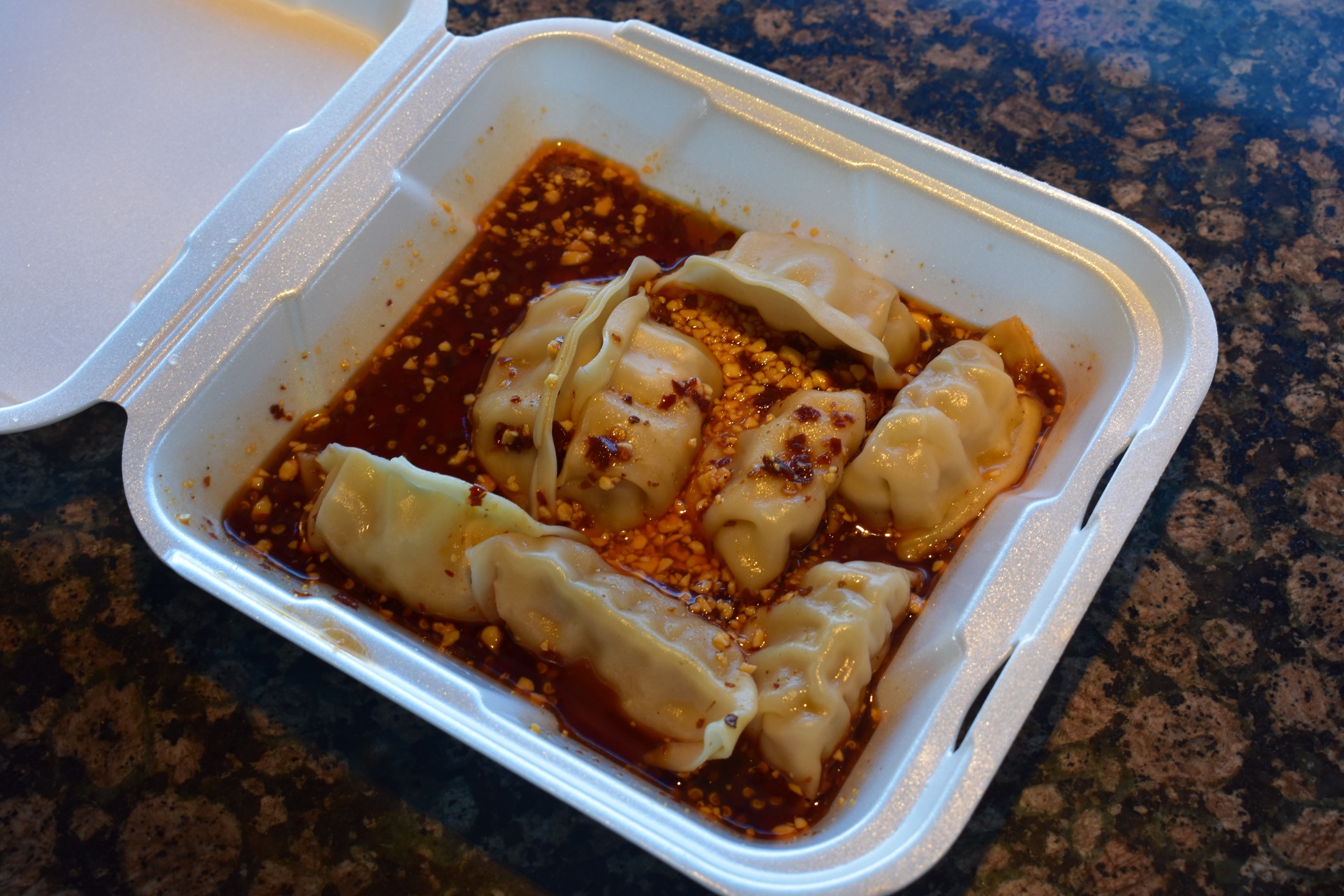 Order 12. Steamed Dumplings with Spicy Sauce food online from Chopstix Asian Diner store, Tucson on bringmethat.com