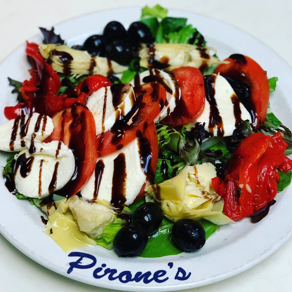 Order Caprese - Appetizer food online from Pirone Restaurant & Catering store, Hainesport on bringmethat.com
