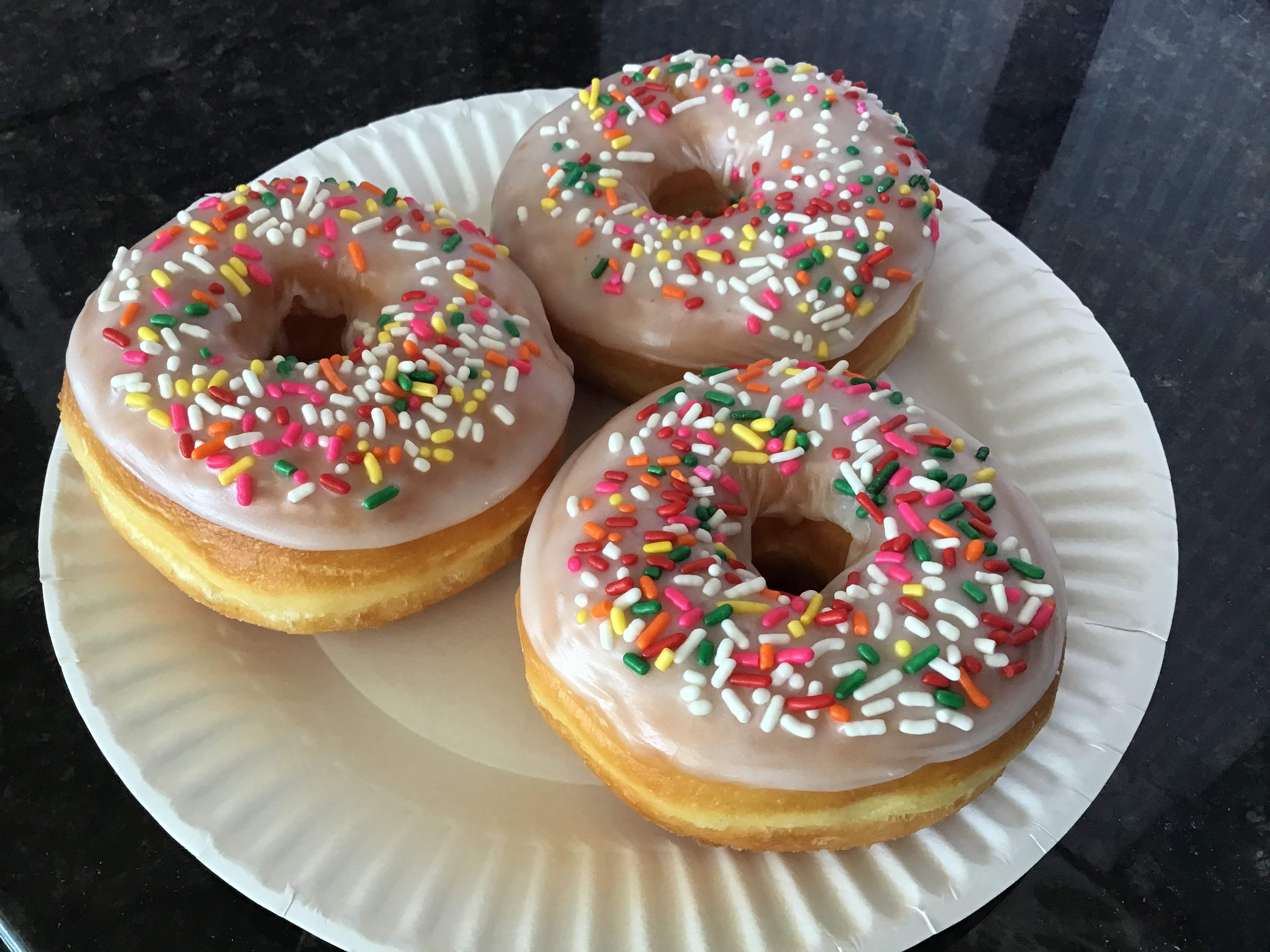 Order Raised Donut with Vanilla Sprinkle food online from Donut Basket store, Modesto on bringmethat.com