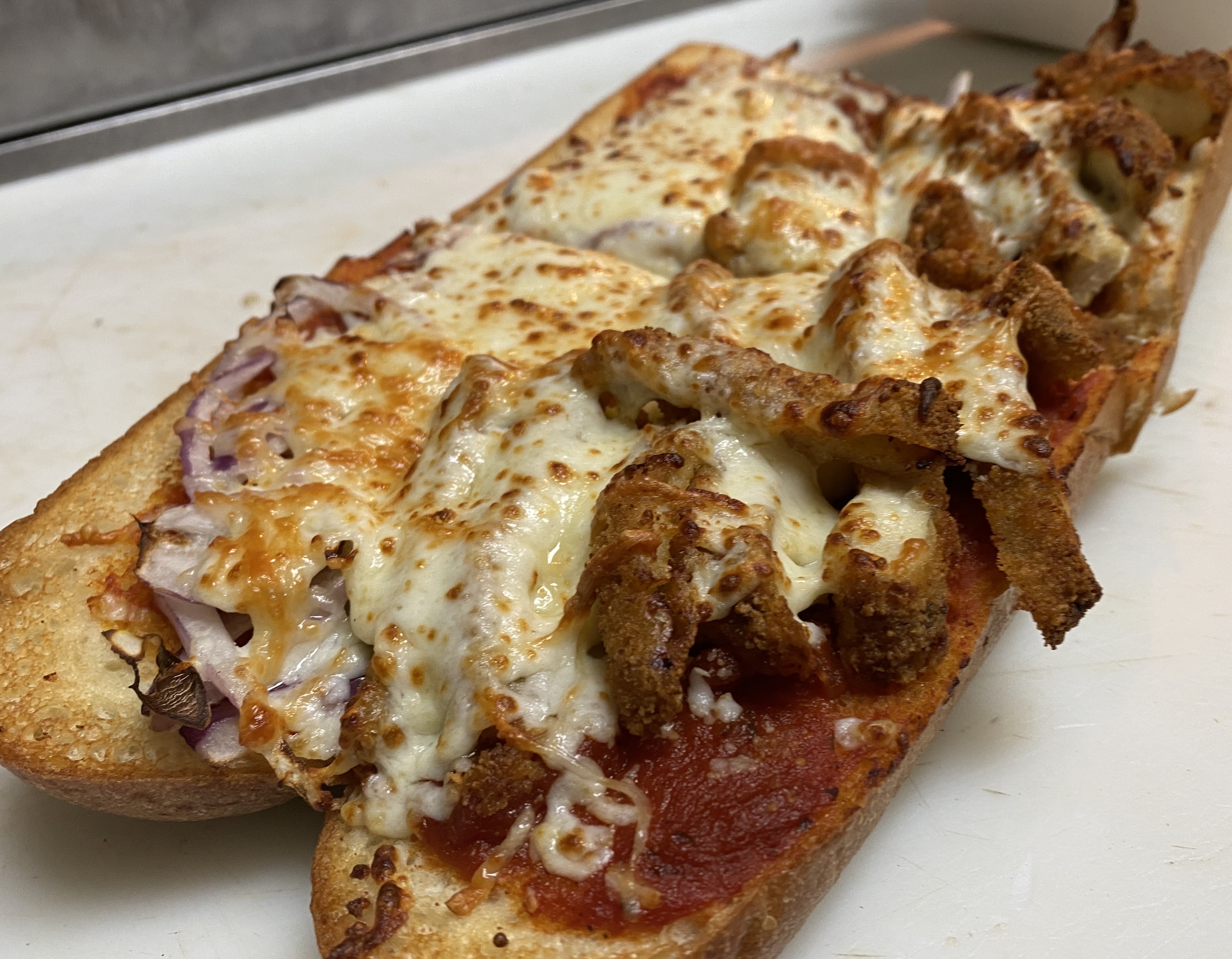 Order Chicken Parmesan Grinder (T) food online from Razzis Pizzeria store, Seattle on bringmethat.com