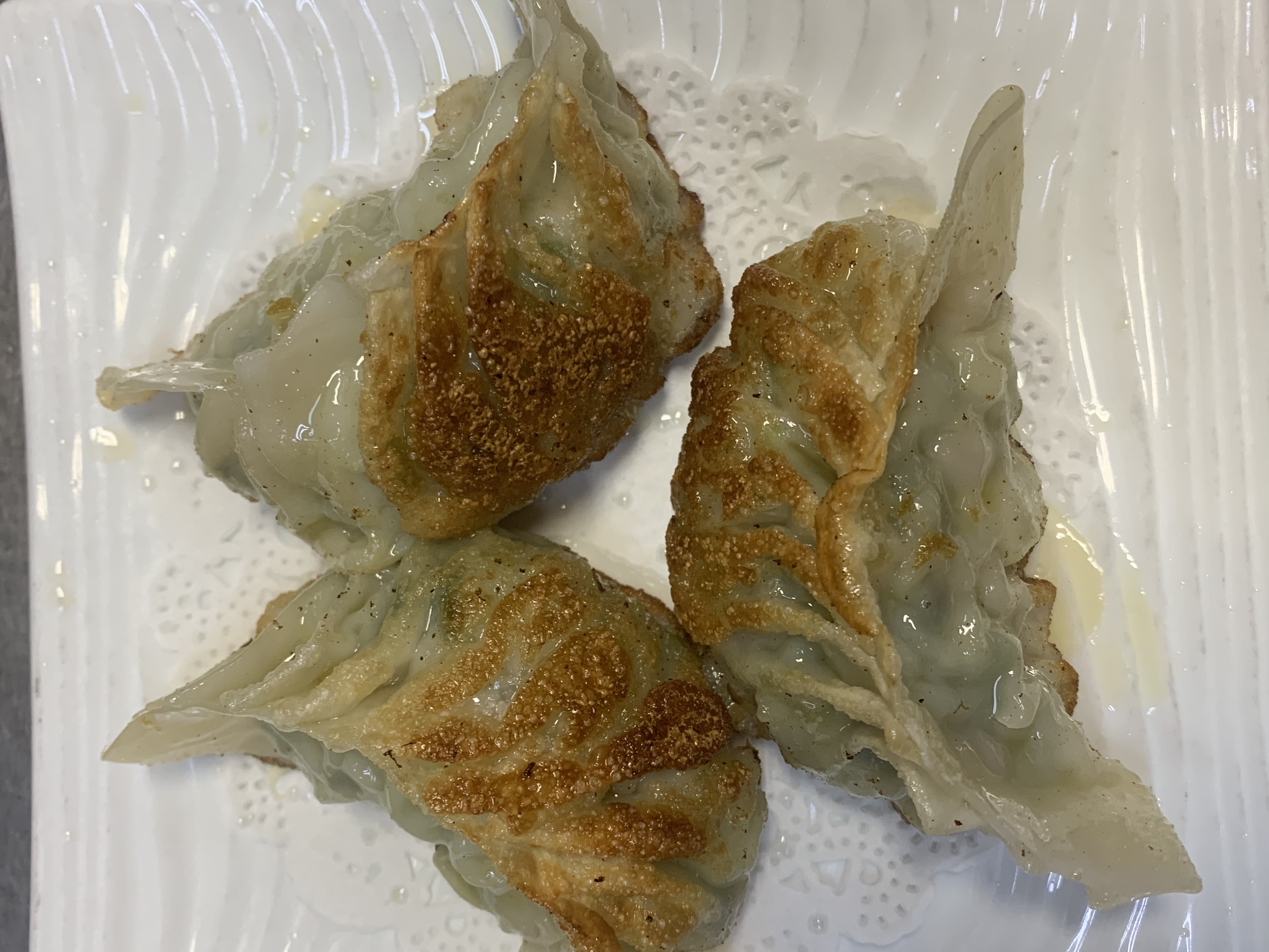 Order 37. Medium Pan Fried Potsticker food online from China Town Cafe store, Chicago on bringmethat.com