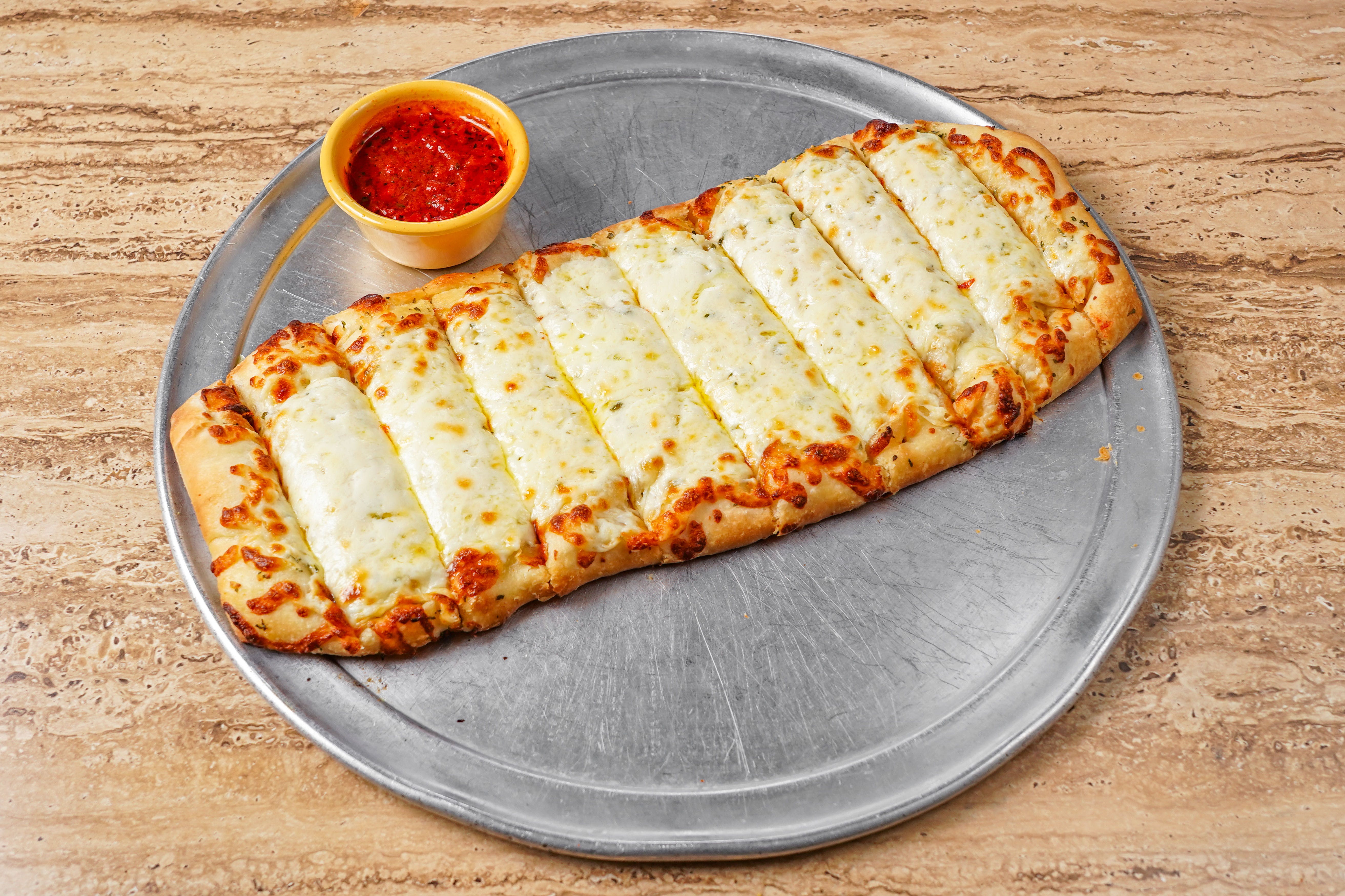 Order Breadsticks & Dip - Appetizer food online from Chicagos Pizza store, San Antonio on bringmethat.com