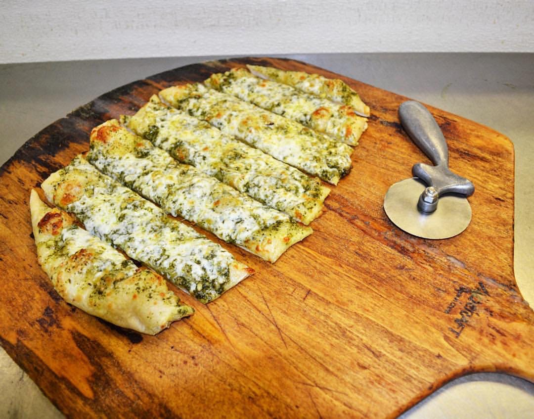 Order 10 Pieces Pesto Bread Sticks food online from New York Pizza & Pasta store, San Leandro on bringmethat.com