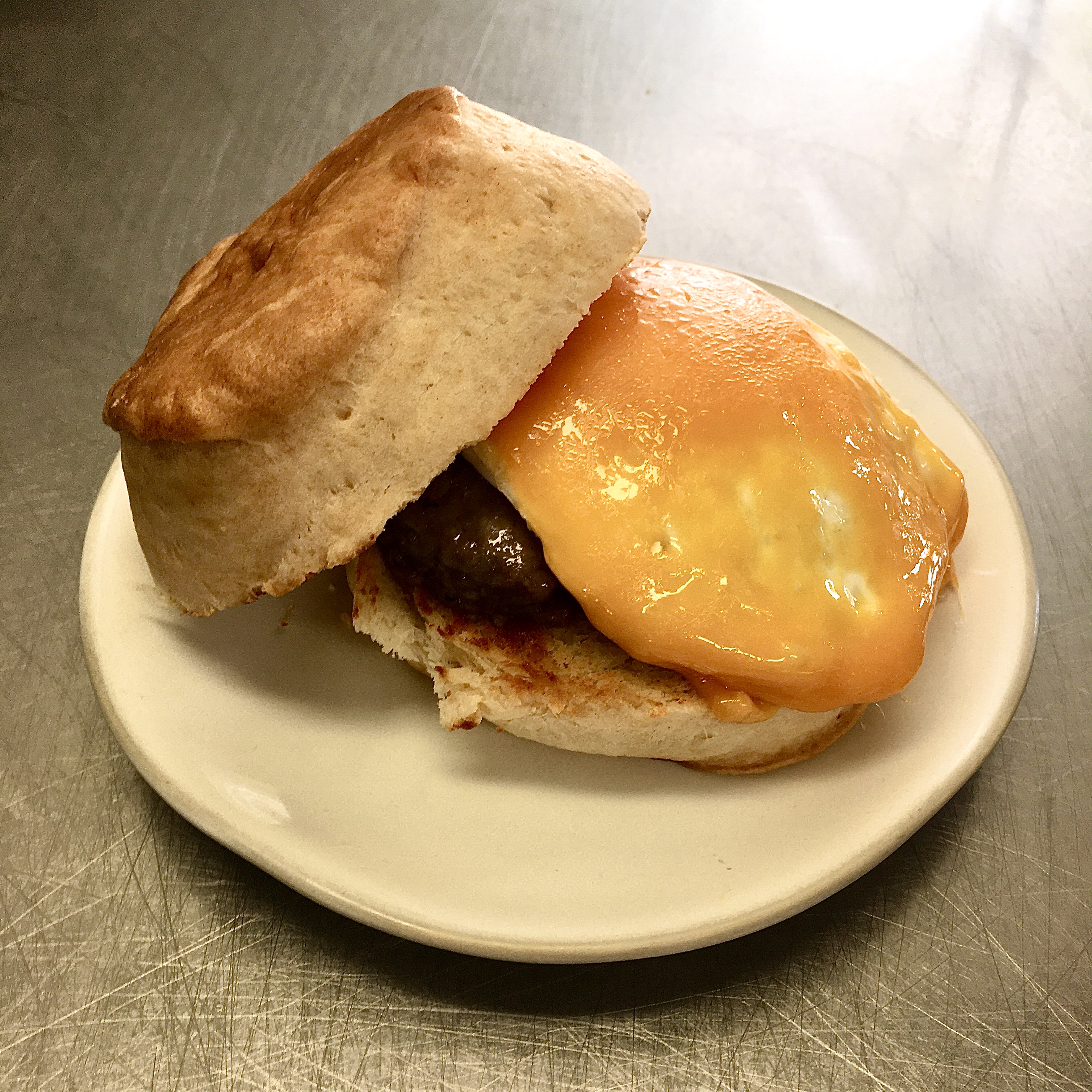 Order Egg, Sausage, and Biscuit Sandwich food online from Pura Vida Coffee store, Hagerstown on bringmethat.com