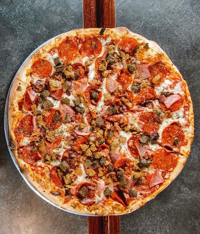 Order Meat Lover's Deluxe Pizza - 14'' (Serves 2-3) food online from Zio's Pizza & Wings store, Mesa on bringmethat.com