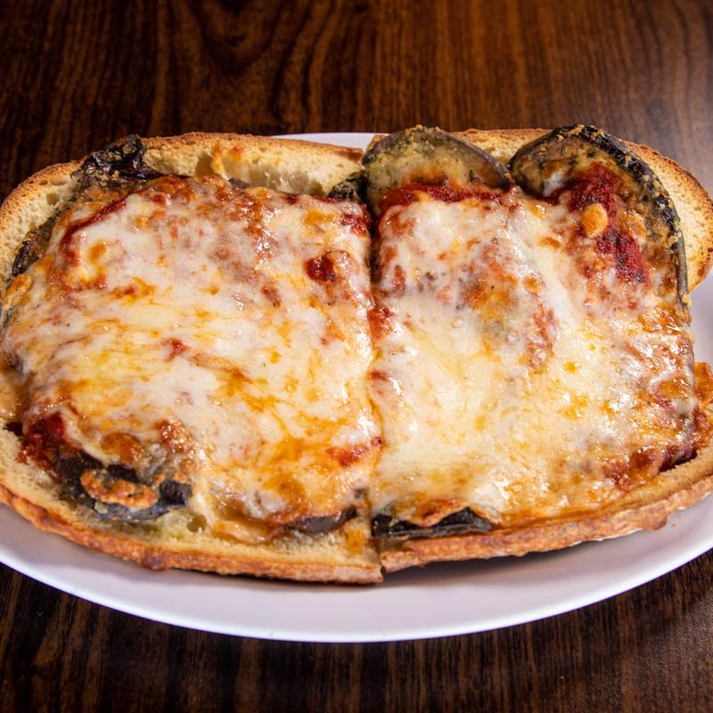 Order Eggplant Parm Sub food online from Rico Pizzeria store, Englewood on bringmethat.com