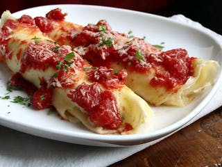 Order Manicotti - Pasta food online from Pino Ii Pizzeria & Restaurant store, Nazareth on bringmethat.com