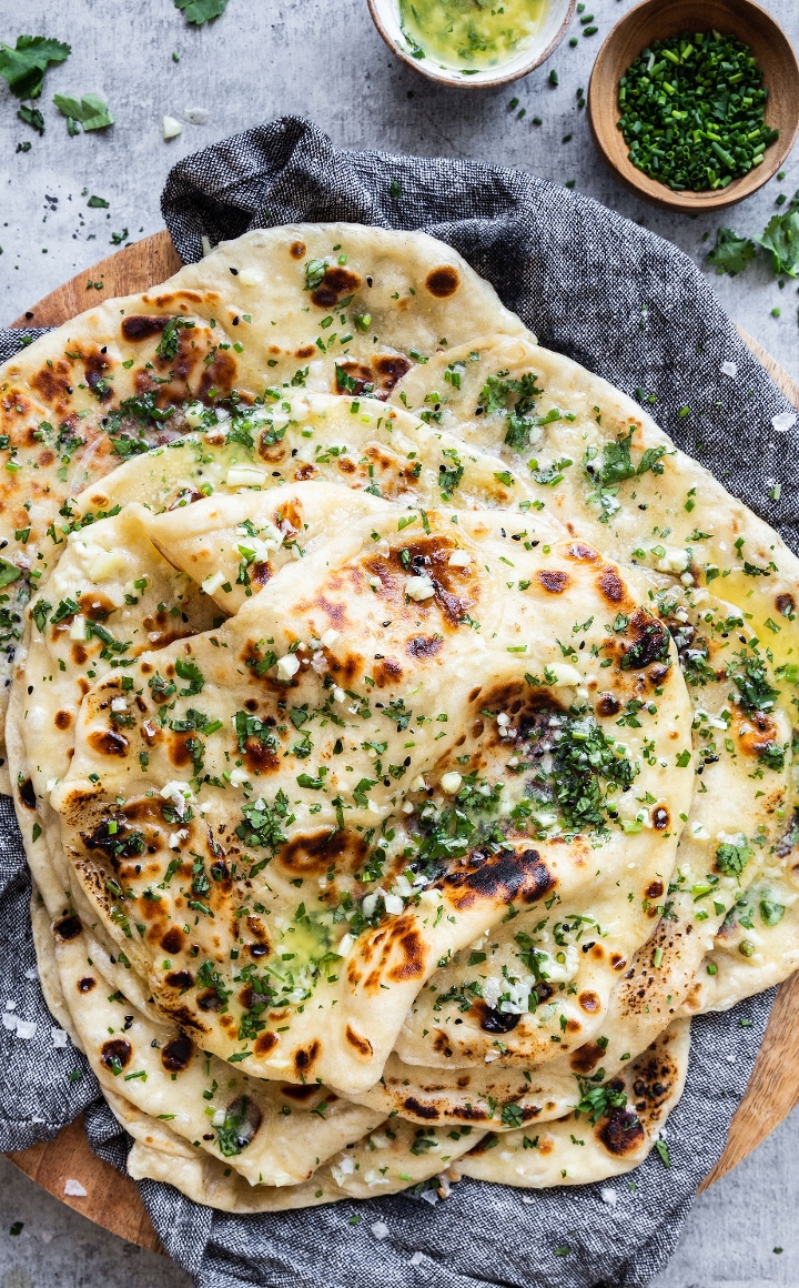 Order Garlic Naan food online from Madras Cafe store, San Diego on bringmethat.com