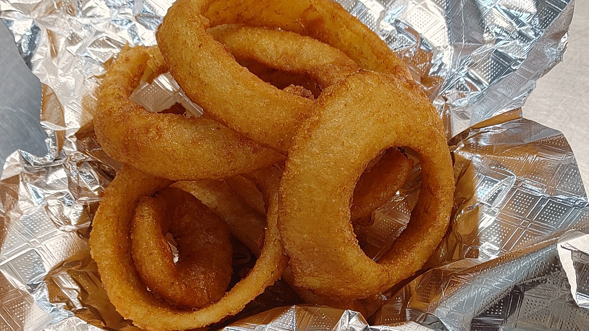 Order Beer Battered Onion Rings food online from Burgers Near Me store, Huffman on bringmethat.com