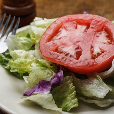 Order Tossed Salad food online from Mandina's Restaurant store, Mandeville on bringmethat.com