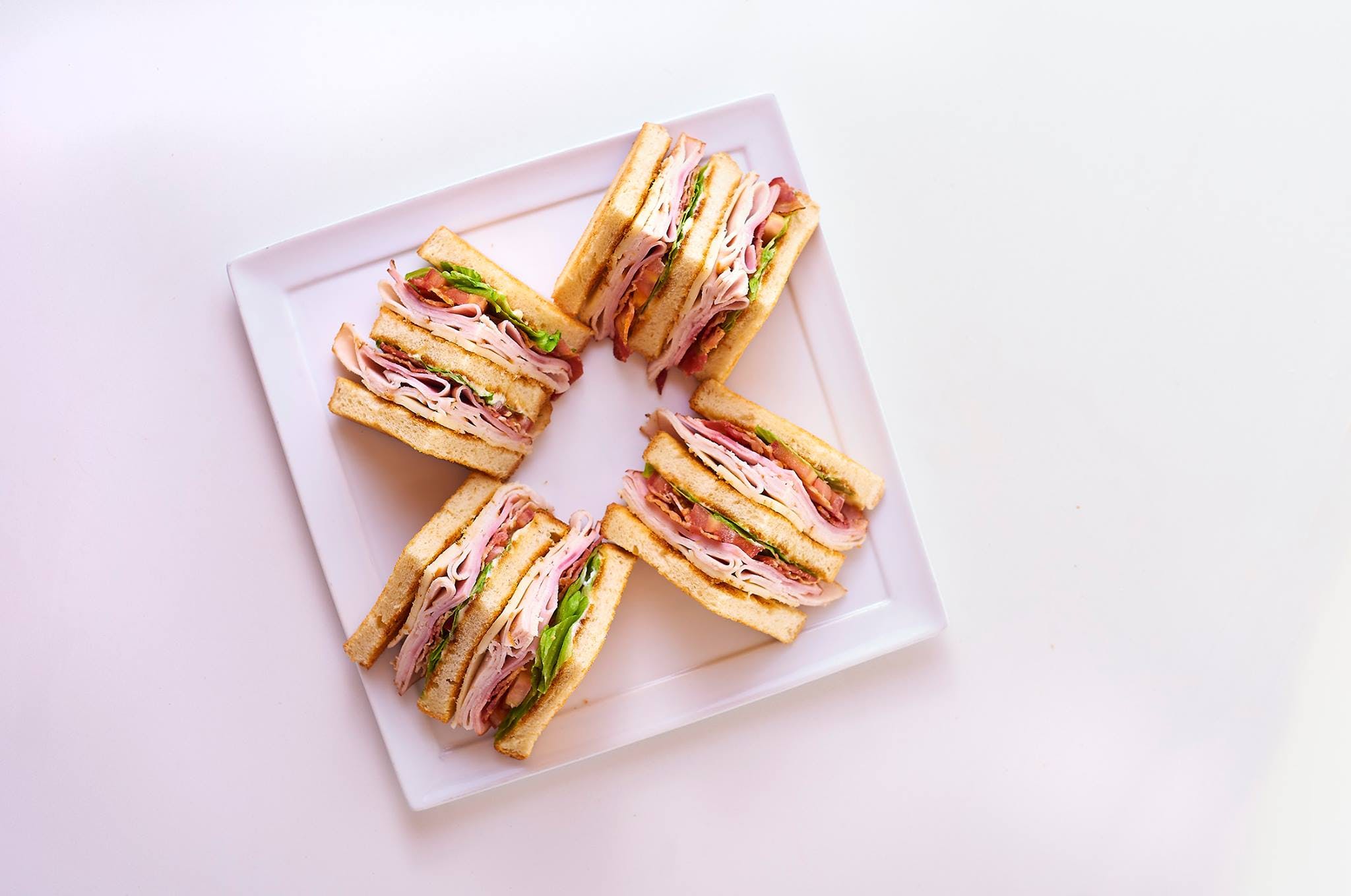 Order Triple Decker Club Sandwich - Sandwich food online from Paisano's Pizza store, Lake Ridge on bringmethat.com