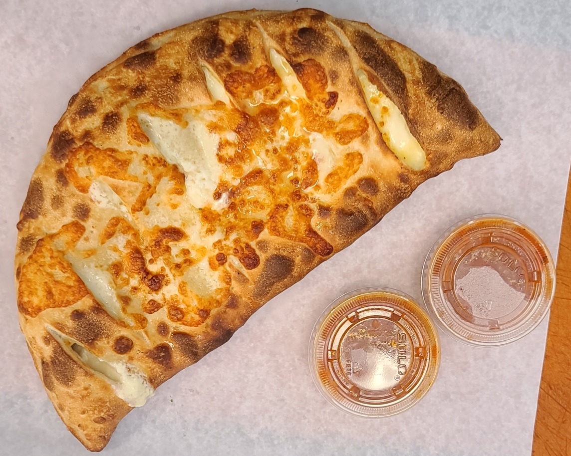 Order Spinach Feta Calzone food online from Gregory House Of Pizza store, Belmont on bringmethat.com