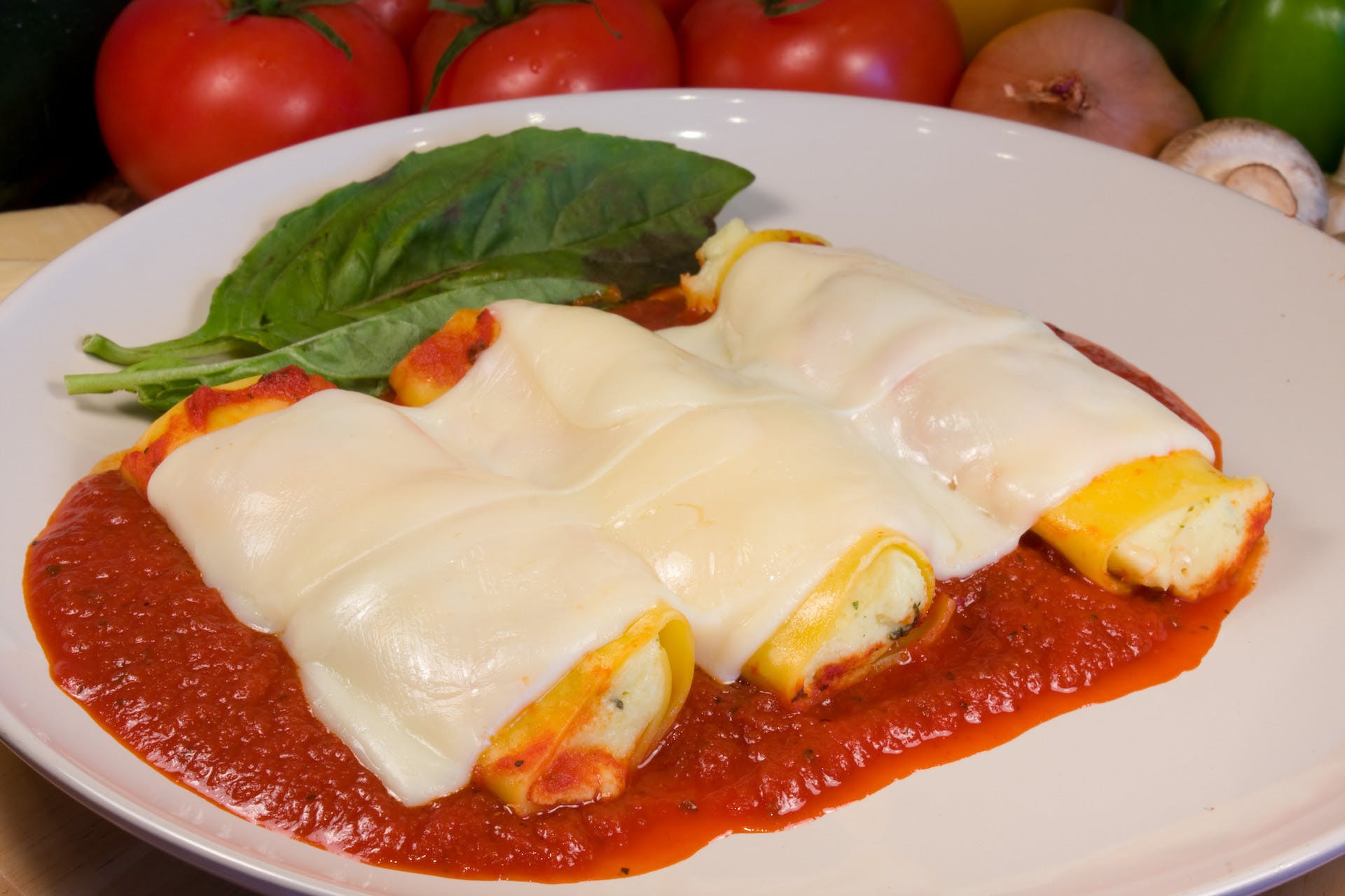 Order Baked Manicotti - Pasta food online from Ameci Pizza & Pasta store, Westlake Village on bringmethat.com