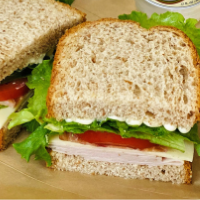 Order Turkey and Provolone on Wheatberry Sandwich food online from Simply Vanilla Gourmet store, Lynchburg on bringmethat.com
