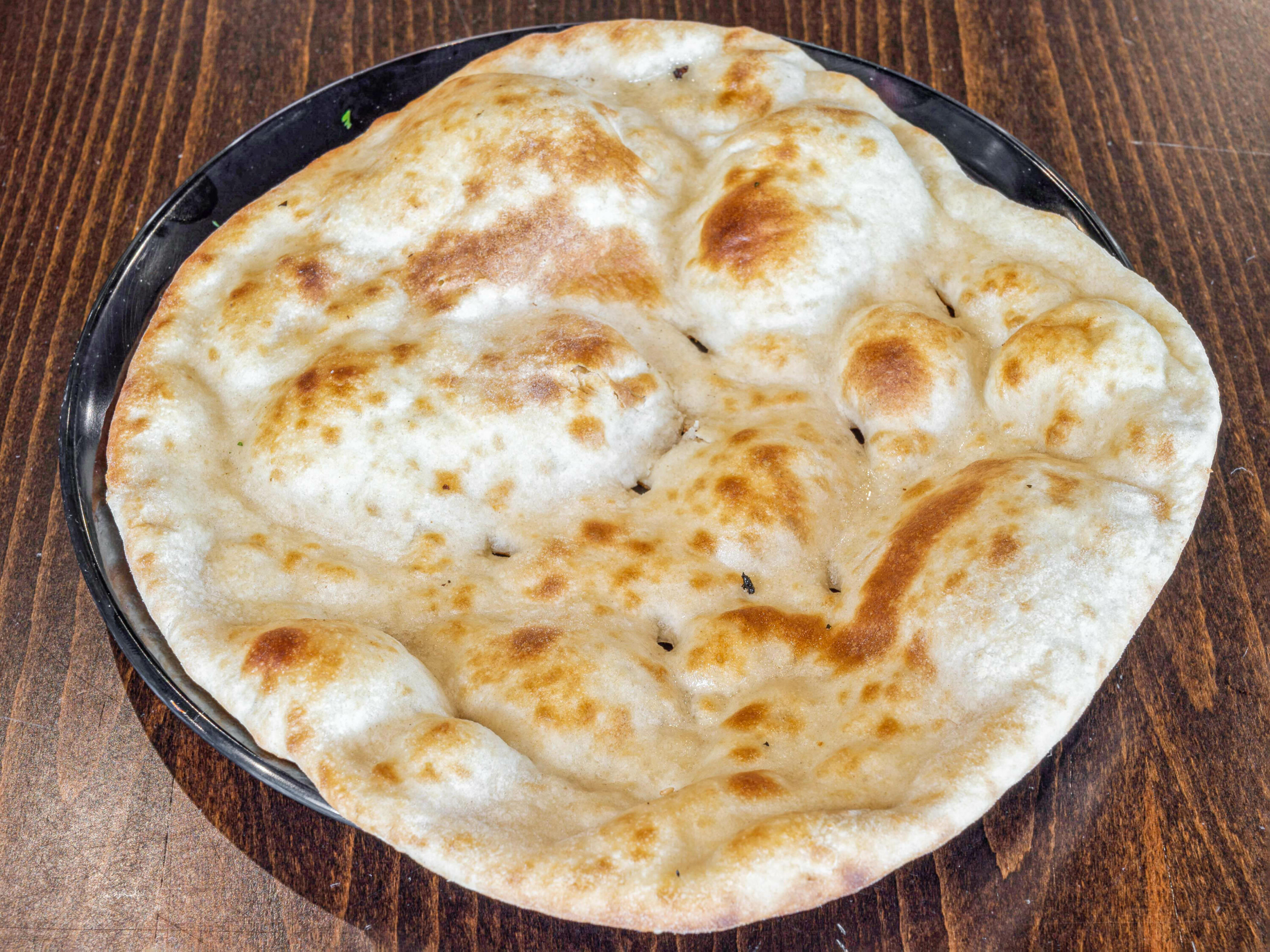 Order Plain Naan food online from Tabaq Restaurant store, Edison on bringmethat.com