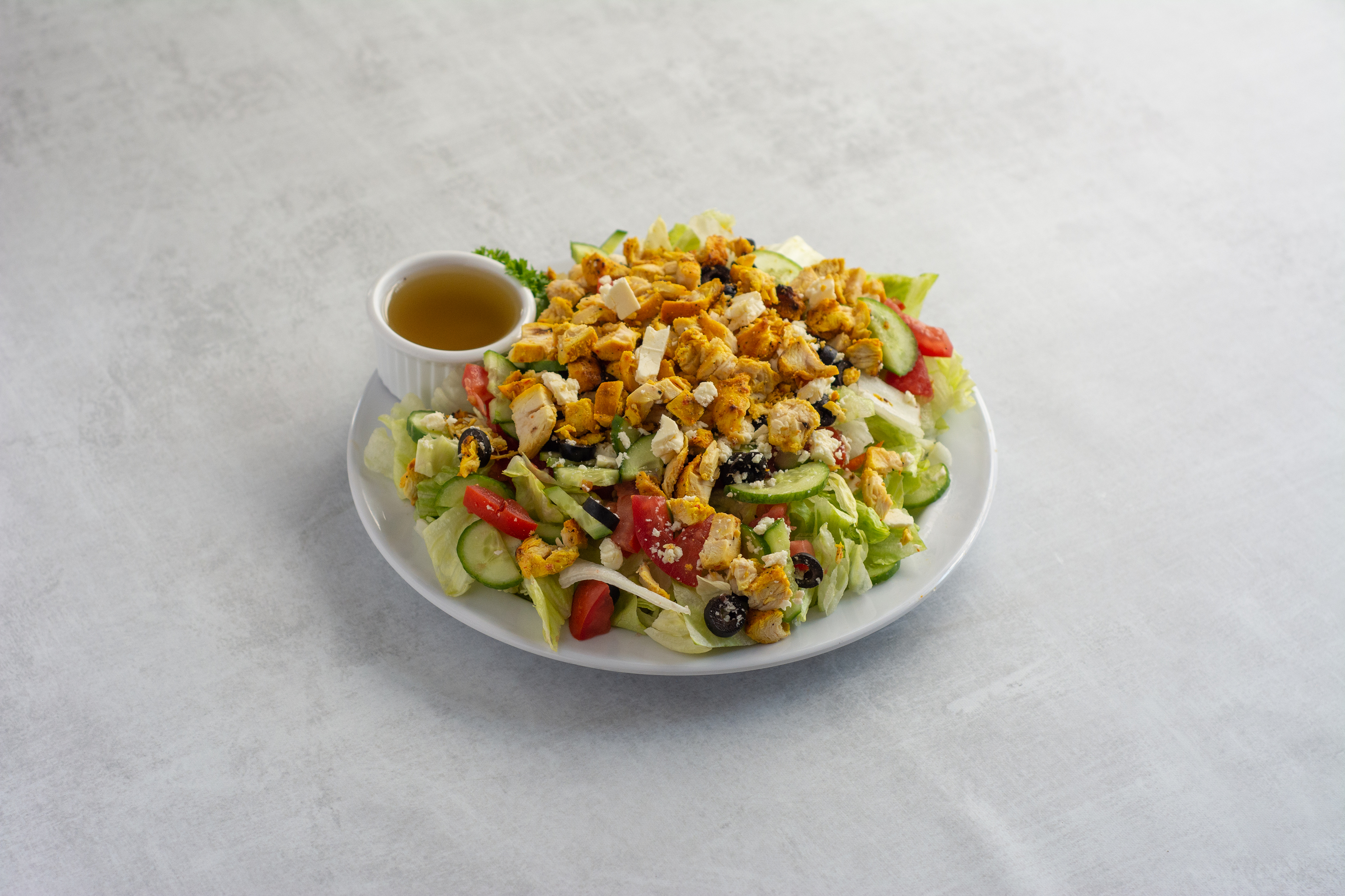 Order 4. Greek Salad with Chicken food online from Caravan restaurant store, Glendale on bringmethat.com