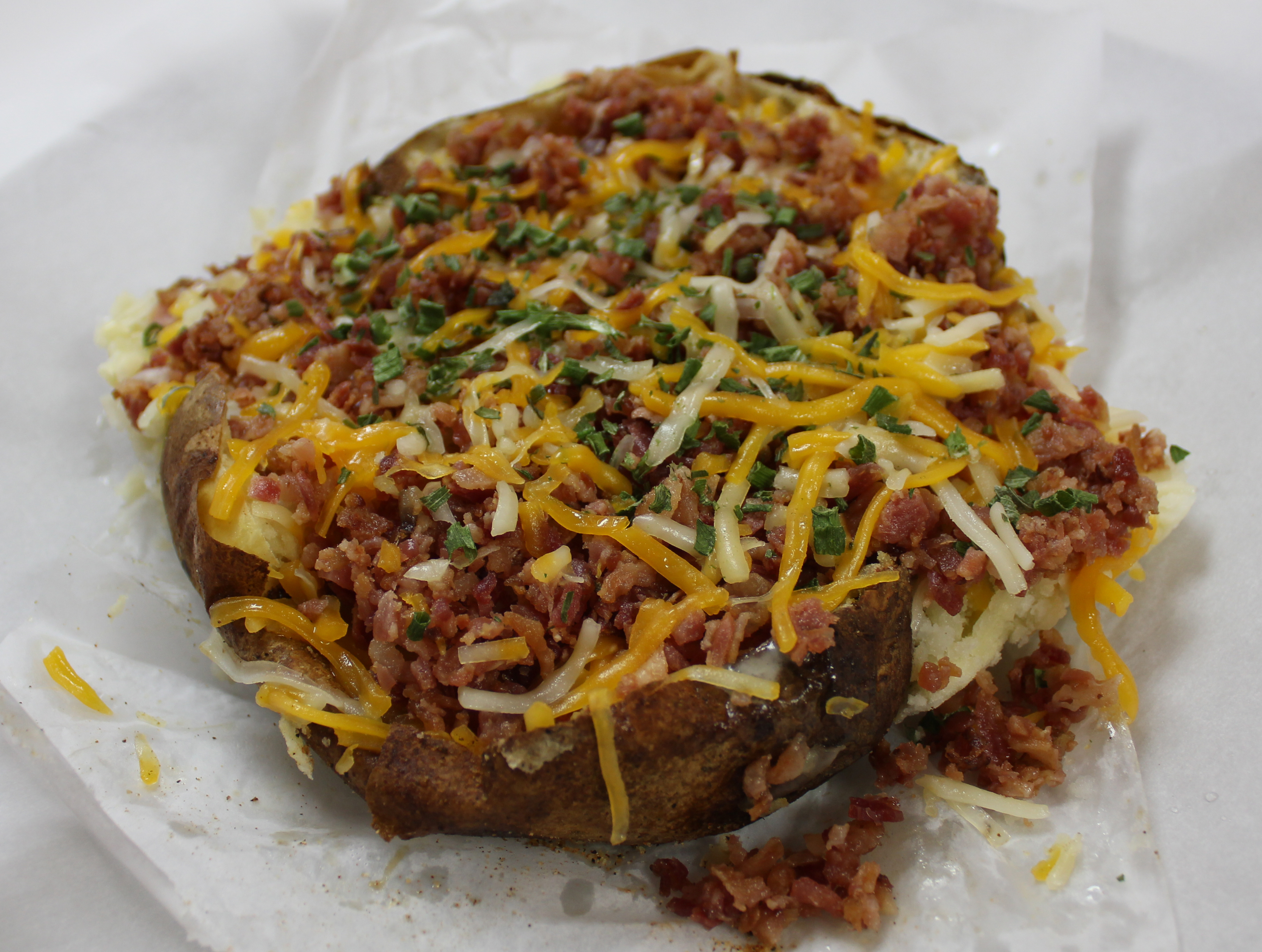 Order 4. Bacon Cheddar Baked Potato food online from Georgia Potato Factory store, Fayetteville on bringmethat.com
