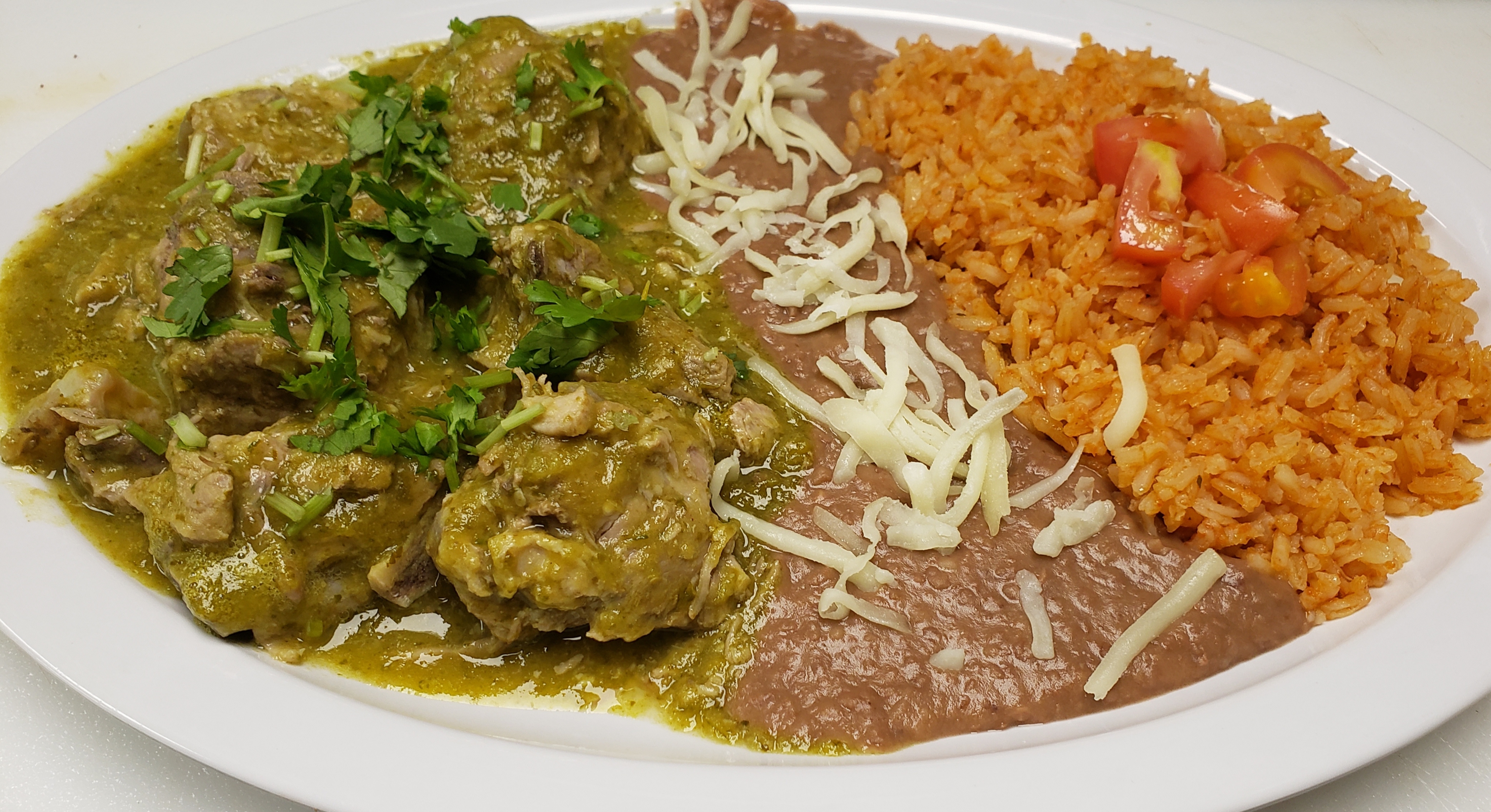 Order Costillas Pork Ribs with Green Sauce food online from Mamicons Mexican Restaurant store, Los Angeles on bringmethat.com