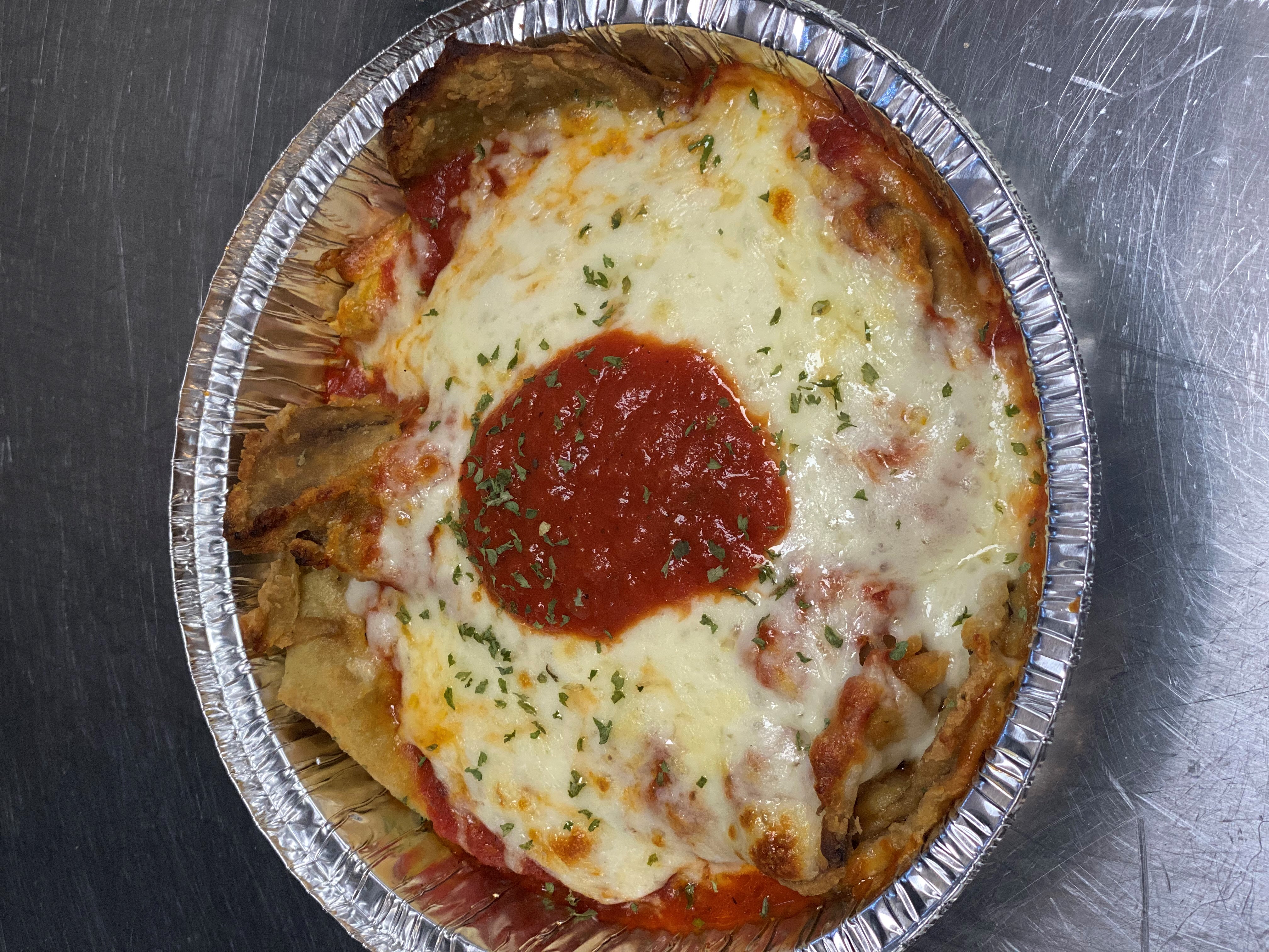 Order Eggplant Parmesan Over Spaghetti food online from Three Brothers Pizza store, Greenbelt on bringmethat.com