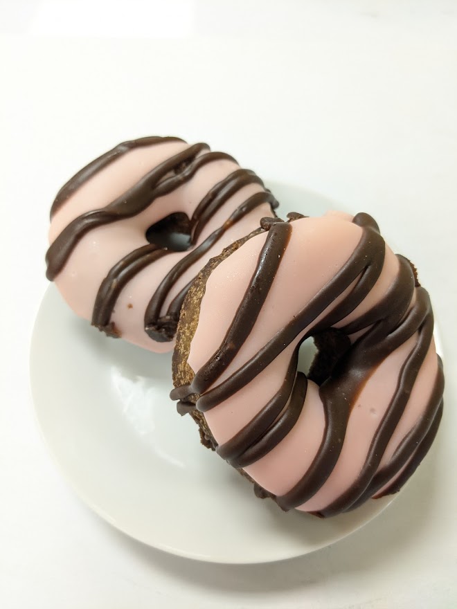 Order Strawberry Icing Donut food online from Morkes Chocolate store, Huntley on bringmethat.com
