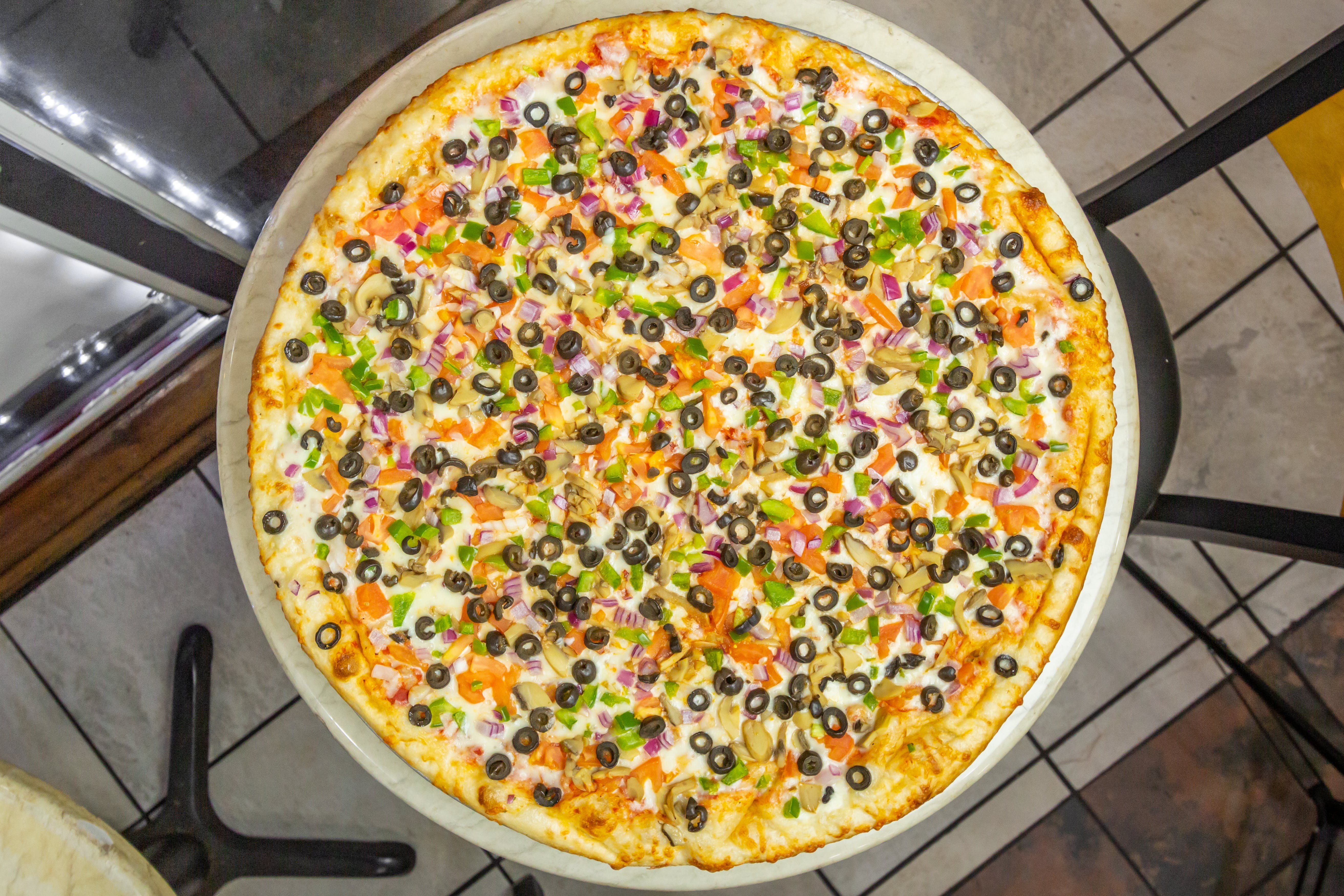 Order Veggie Lover's Pizza - Medium 14'' (6 Slices) food online from Cafe Lark store, Albany on bringmethat.com