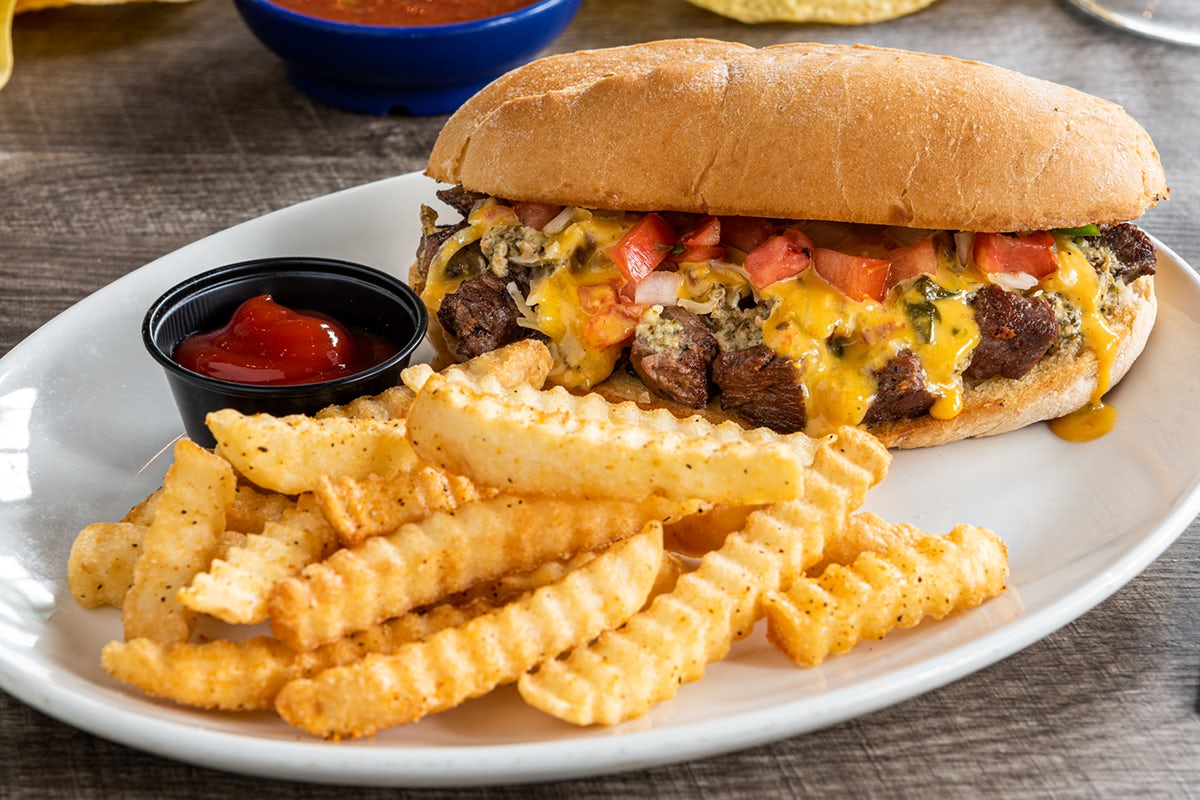 Order Queso Steak Torta food online from On The Border store, Littleton on bringmethat.com