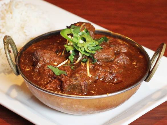 Order Home Style Goat Curry food online from Swagat Indian Cuisine store, Beaverton on bringmethat.com