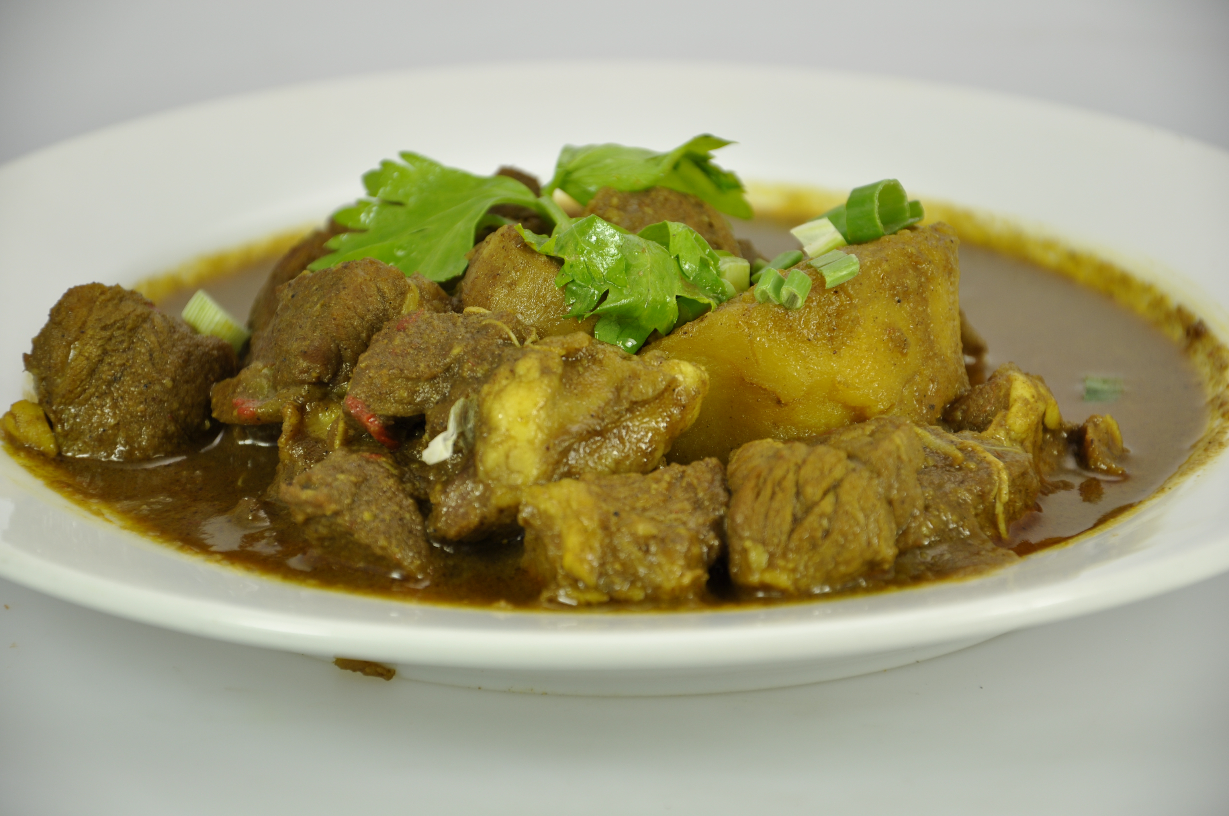 Order Curry Lamb food online from Kaieteur Express Restaurant store, South Richmond Hill on bringmethat.com