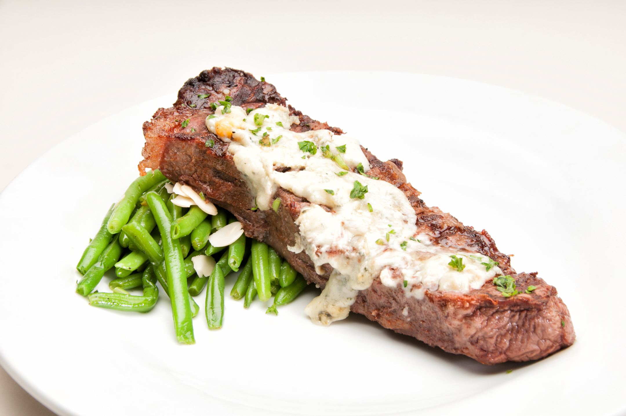 Order Blue Cheese Crusted NY Strip Steak with Vegetables Dinner food online from Barraco's Pizza store, Evergreen Park on bringmethat.com