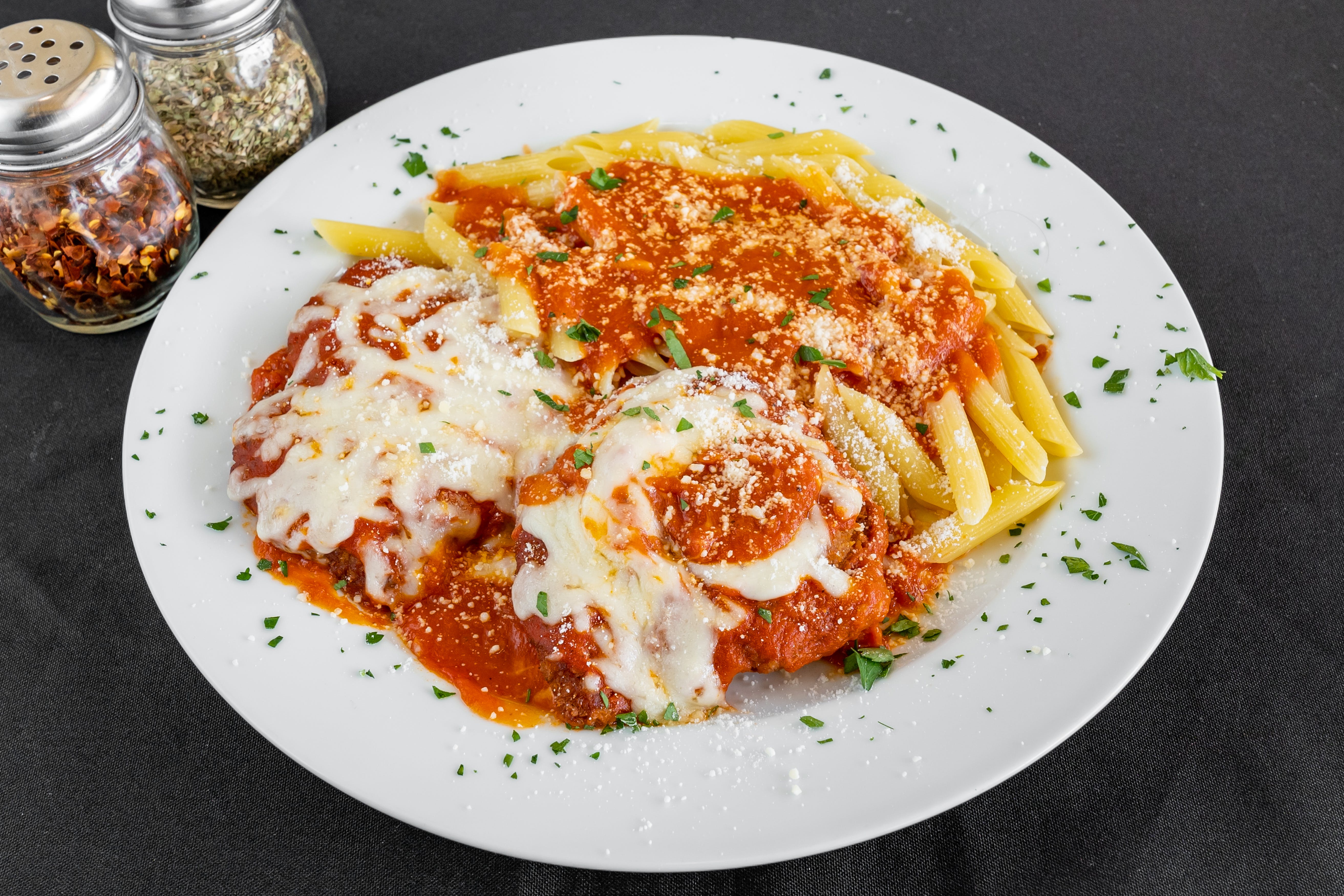 Order Chicken Parmigiana with Spaghetti - Pasta food online from Pizza Plaza Of Warminster store, Warminster on bringmethat.com