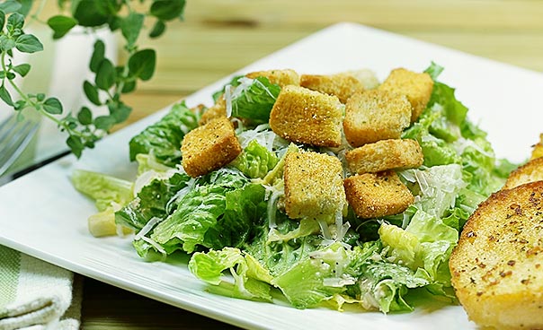 Order Caesar Salad food online from Sicily Pizza & Pasta store, Houston on bringmethat.com