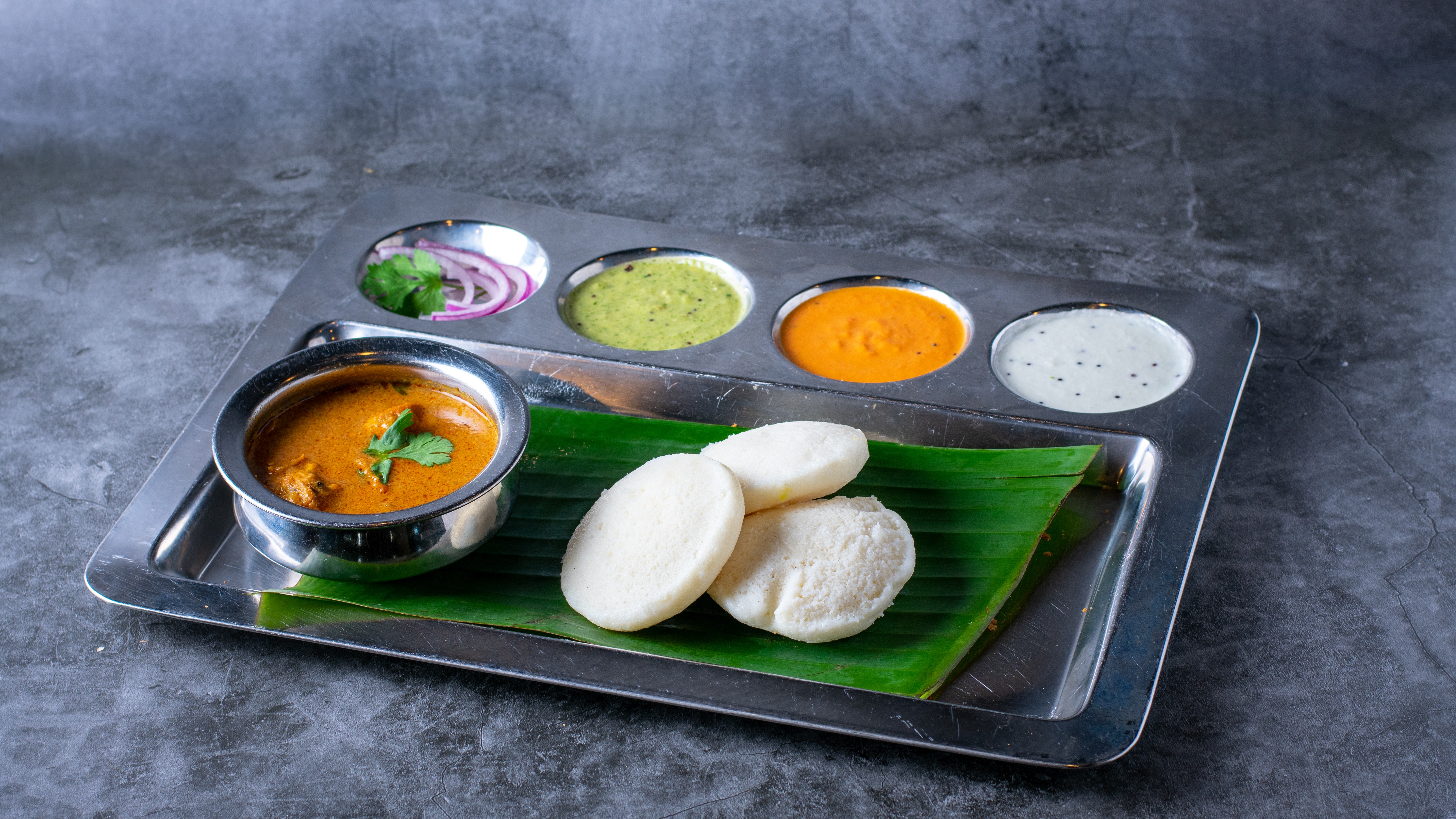 Order Idli Curry Combo - 3 pieces food online from Sangam Chettinad Indian Cuisine store, Austin on bringmethat.com