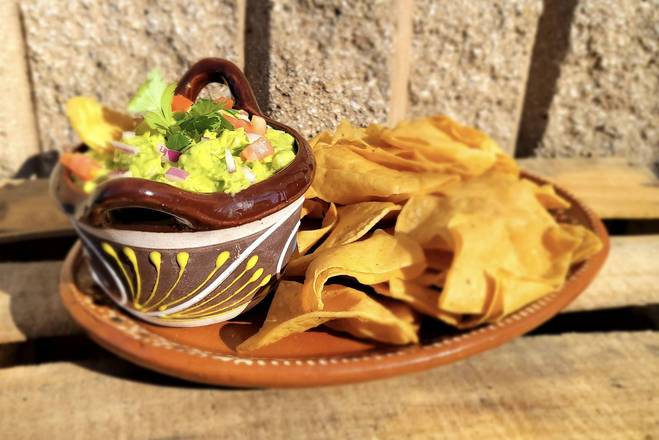 Order Guacamole and Chips (12 oz) food online from El Famous Burrito store, Orland Park on bringmethat.com
