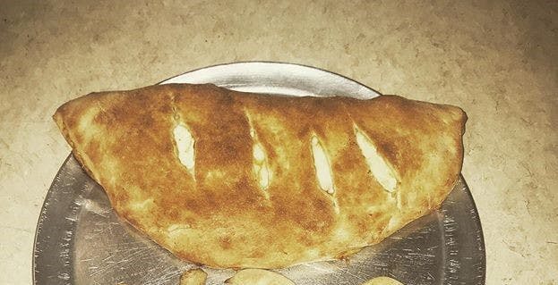 Order Ricotta & Cheese Calzone - Large food online from Pizza Como store, Lehighton on bringmethat.com