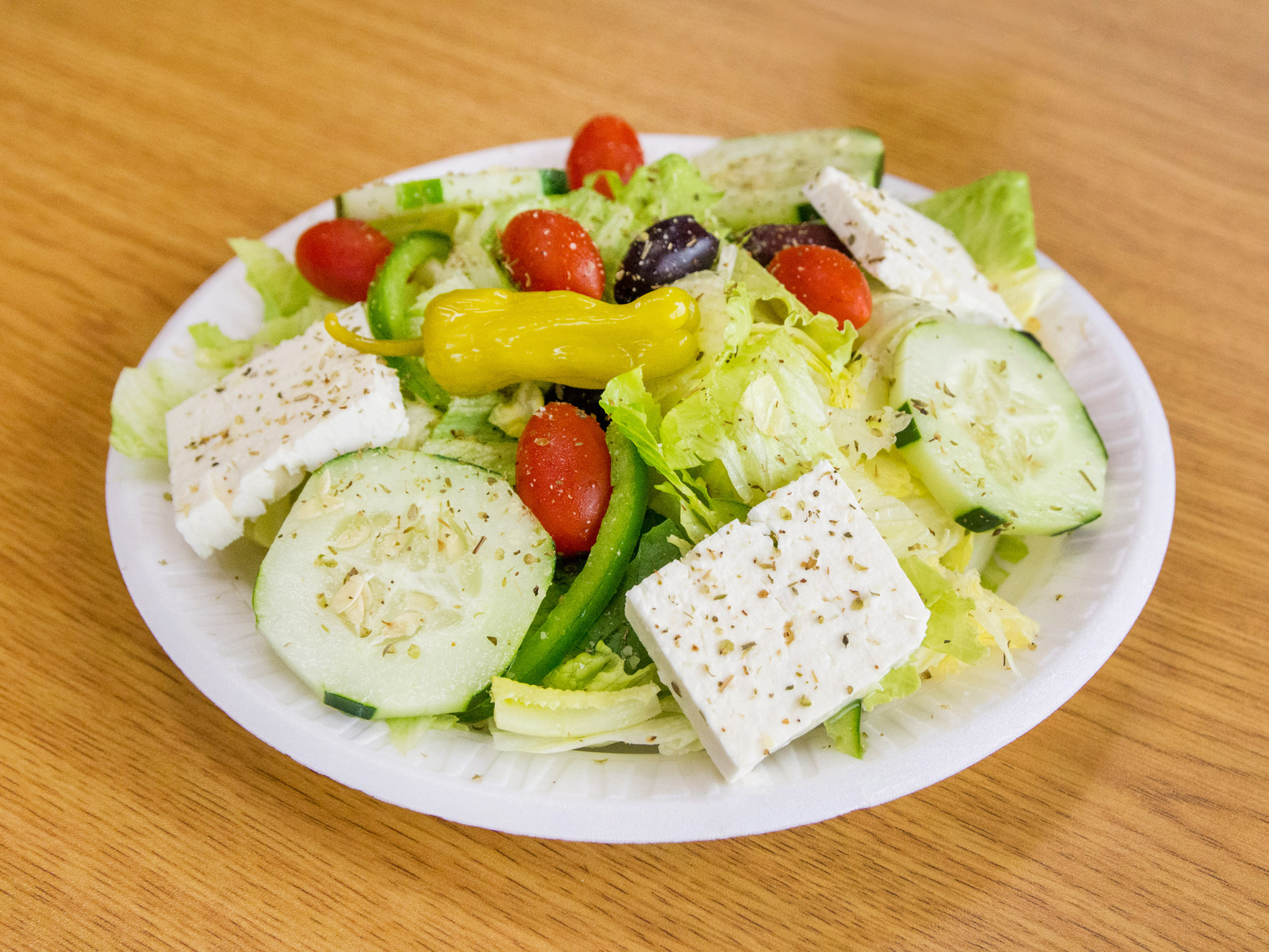 Order Greek Salad food online from Zorba's Pizza store, Edgewood on bringmethat.com
