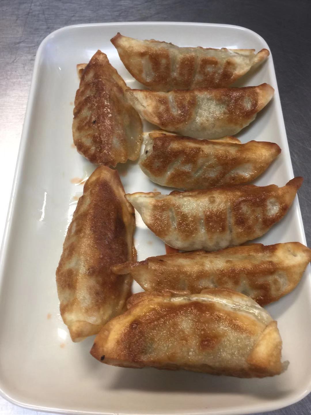 Order 2. Pan Fried Dumplings煎饺子 food online from E&J Yummy Kitchen store, Monterey Park on bringmethat.com