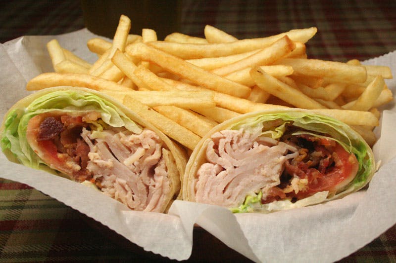 Order Turkey Club Wrap - Wrap food online from Brown Jug store, Chelsea on bringmethat.com