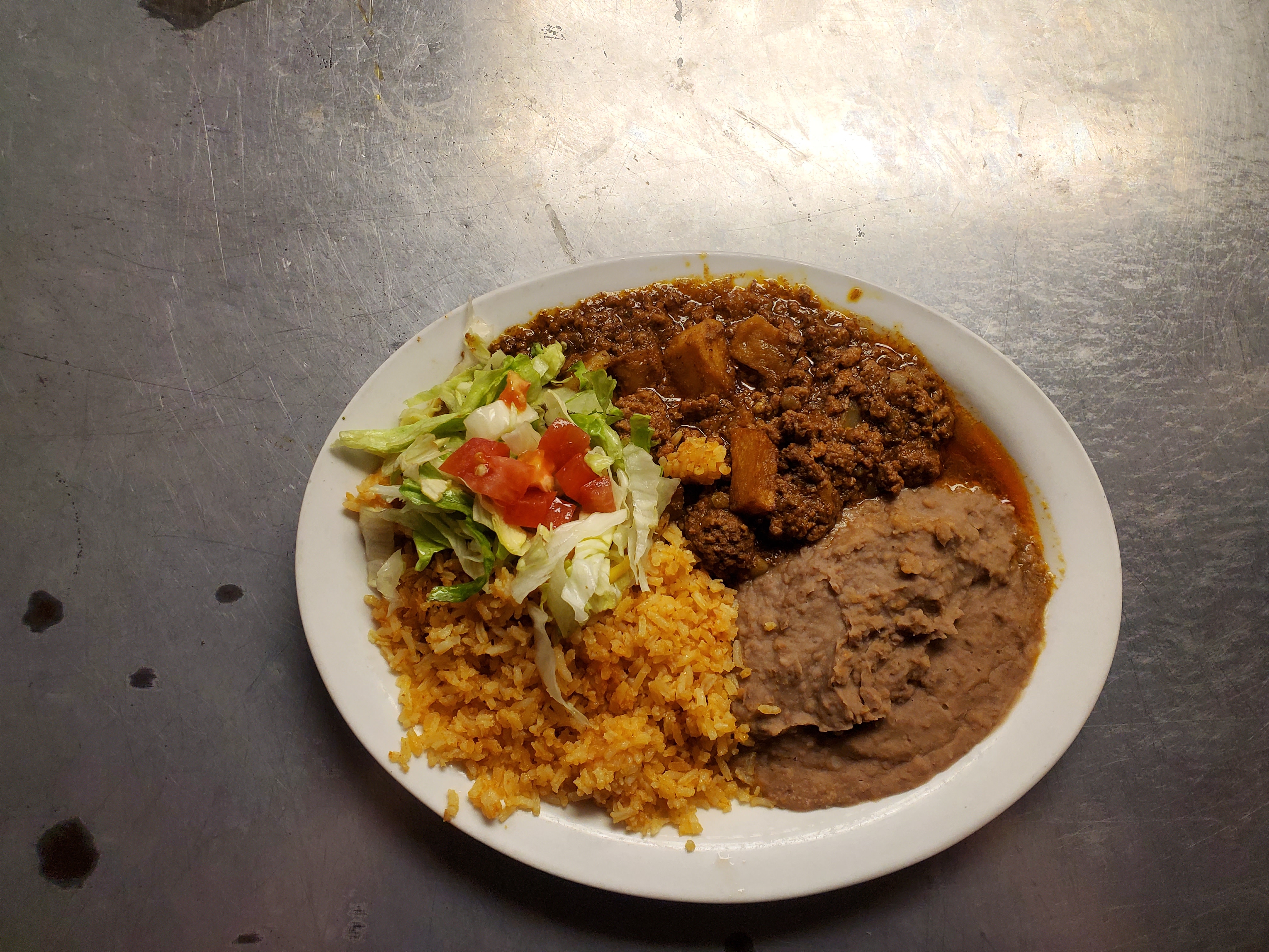Order Picadillo Plate food online from Gilberts Restaurant store, San Antonio on bringmethat.com