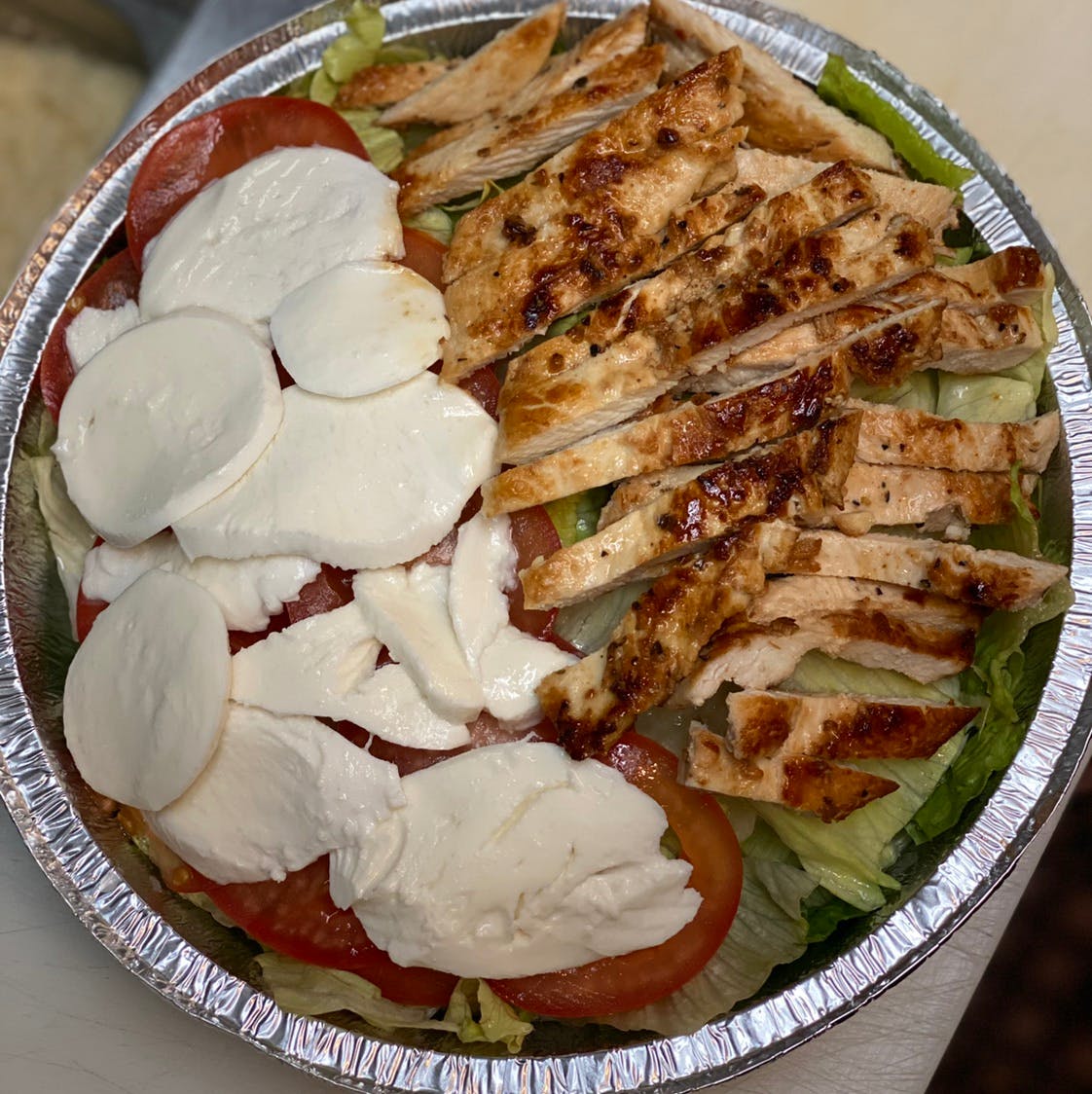 Order Fresh Mozzarella Chicken Salad with Tomatoes - Small food online from Michelangelo's Pizza store, East Brunswick on bringmethat.com
