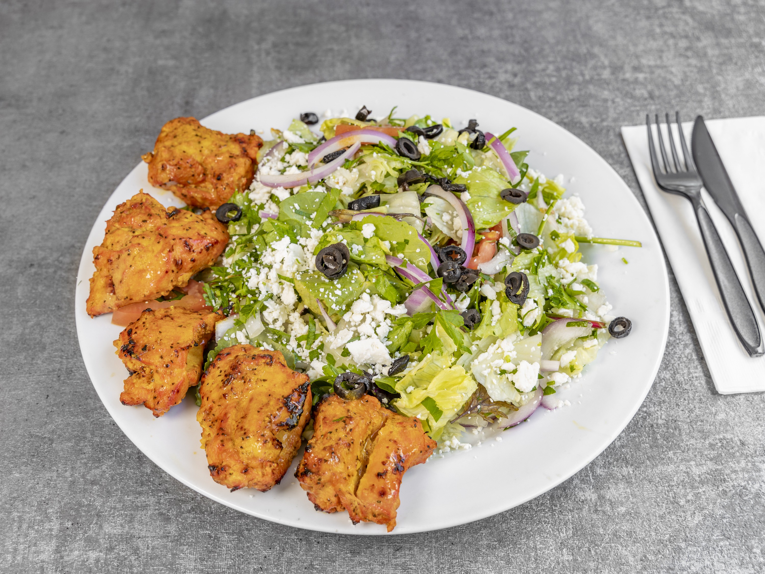 Order Greek Salad food online from Momos Grill store, Irvine on bringmethat.com