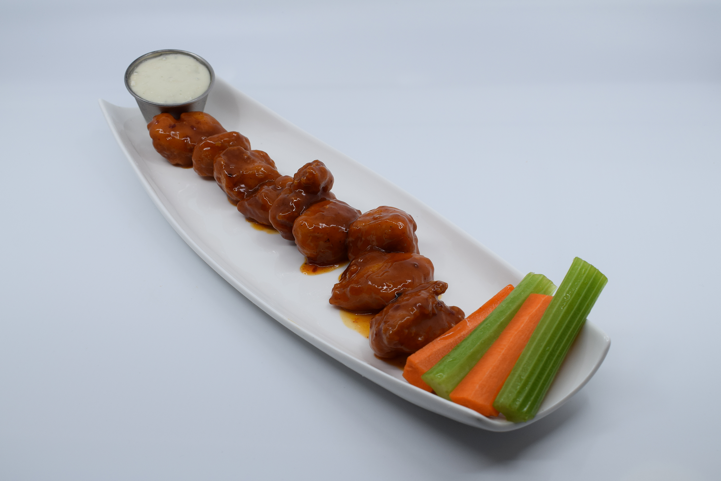 Order Boneless Mango Habanero Wings food online from Mad House Comedy Club store, San Diego on bringmethat.com