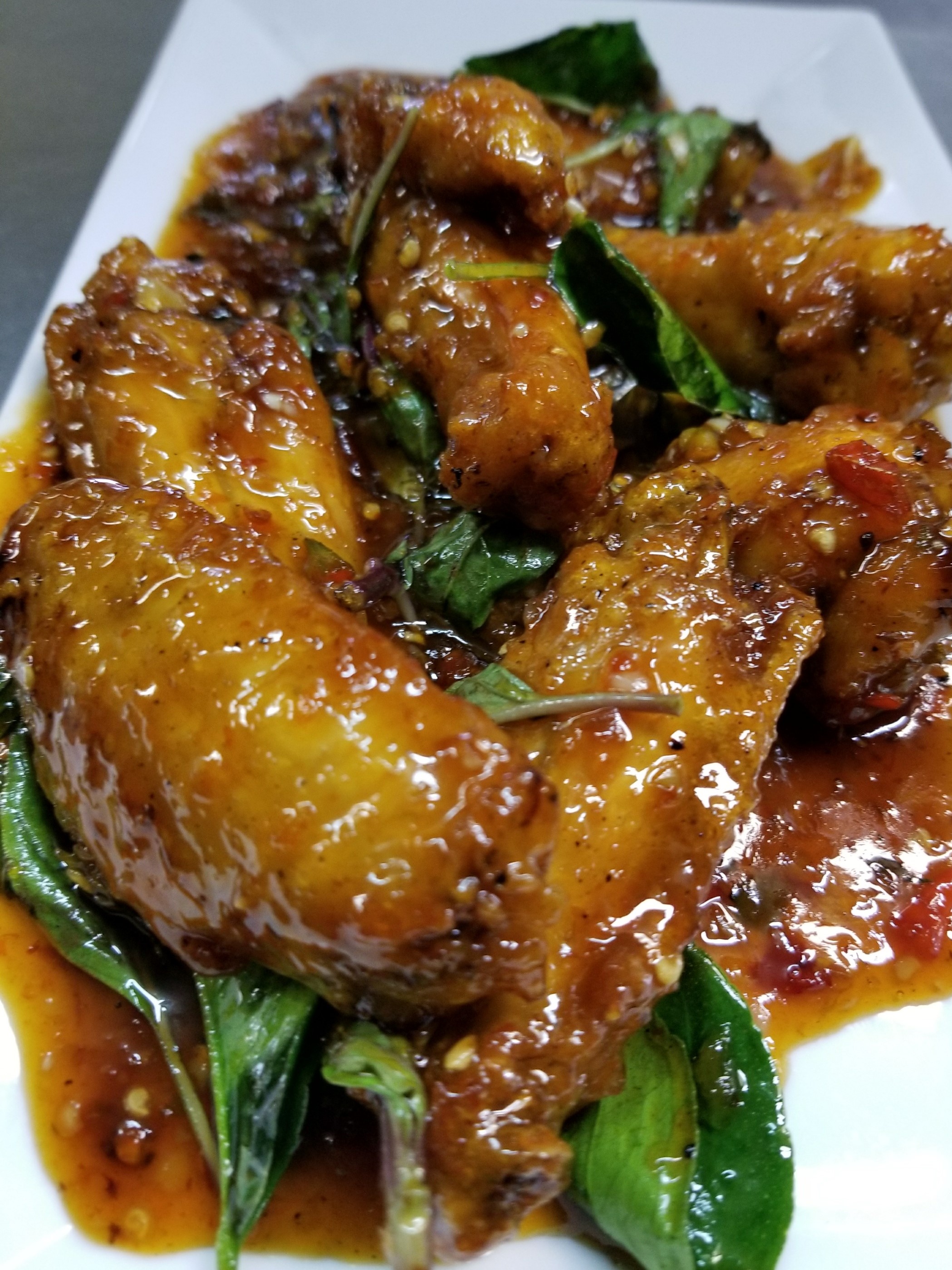 Order 8. Thai Basil Wings food online from Sticky Rice Restaurant store, Modesto on bringmethat.com