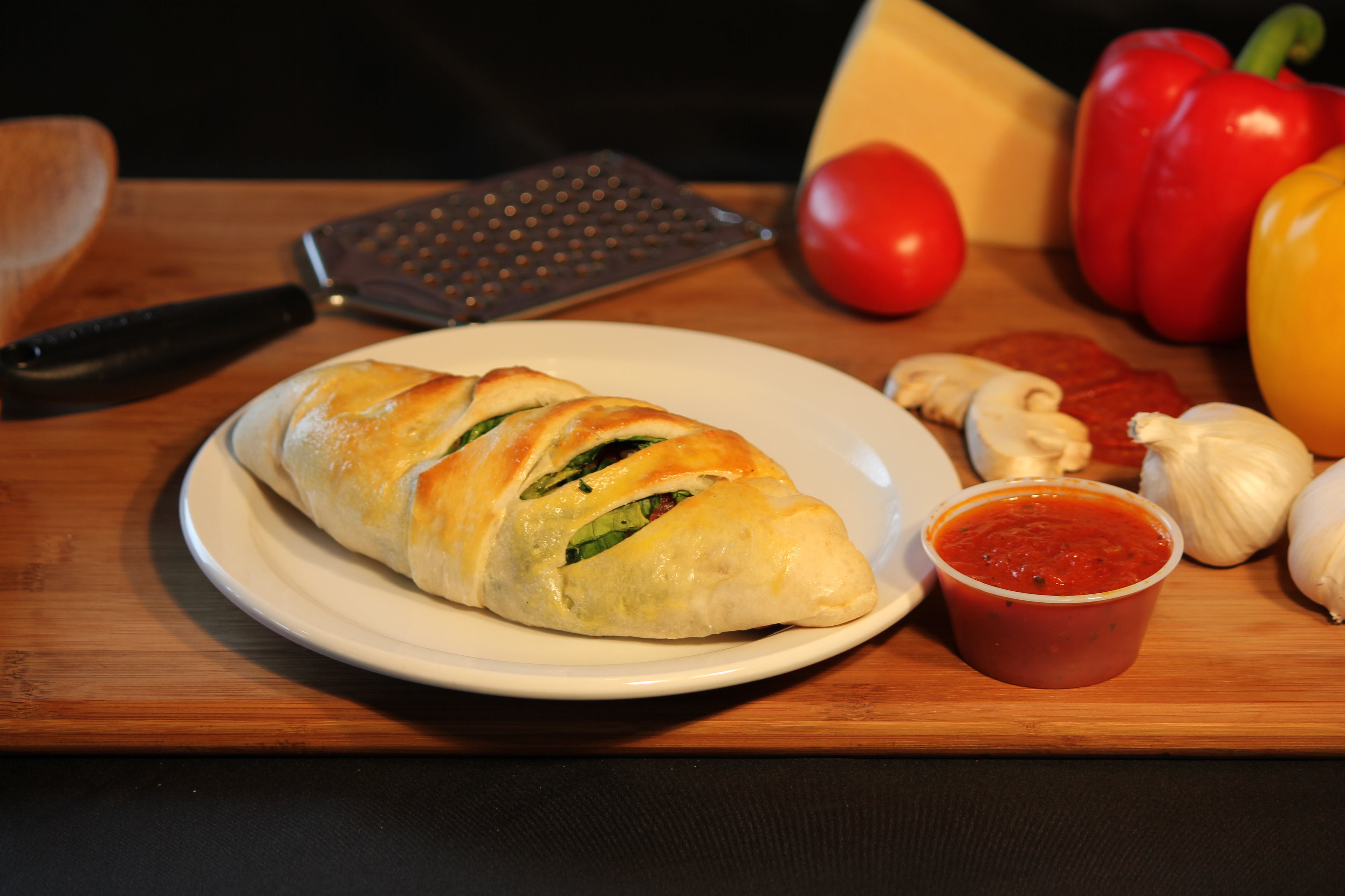 Order Spinach & Cheese Calzone - Calzone food online from Luca Pizza Di Roma store, Findlay on bringmethat.com