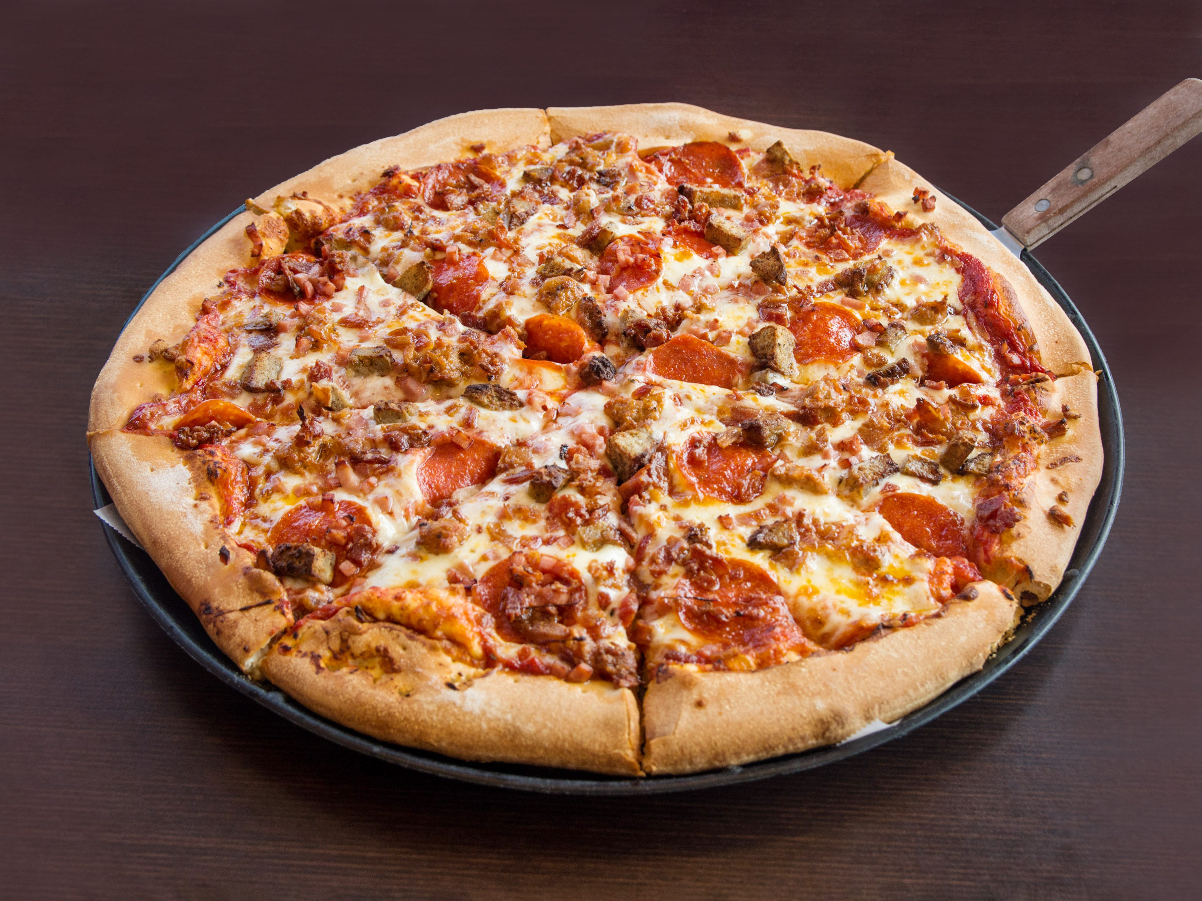 Order Meat Lover’s Pizza food online from Pats Pizza store, Newark on bringmethat.com