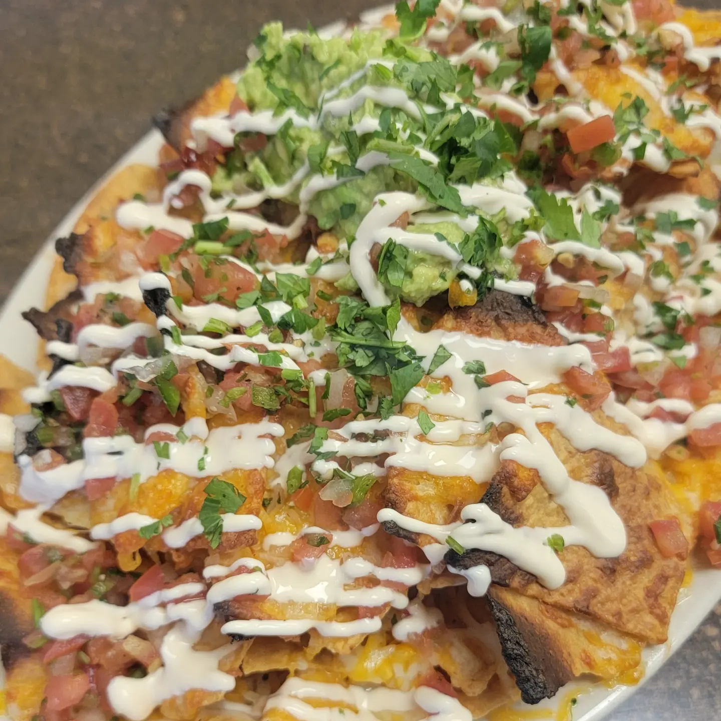 Order Nachos food online from Bucci's Deli and Pizzeria store, Everett on bringmethat.com