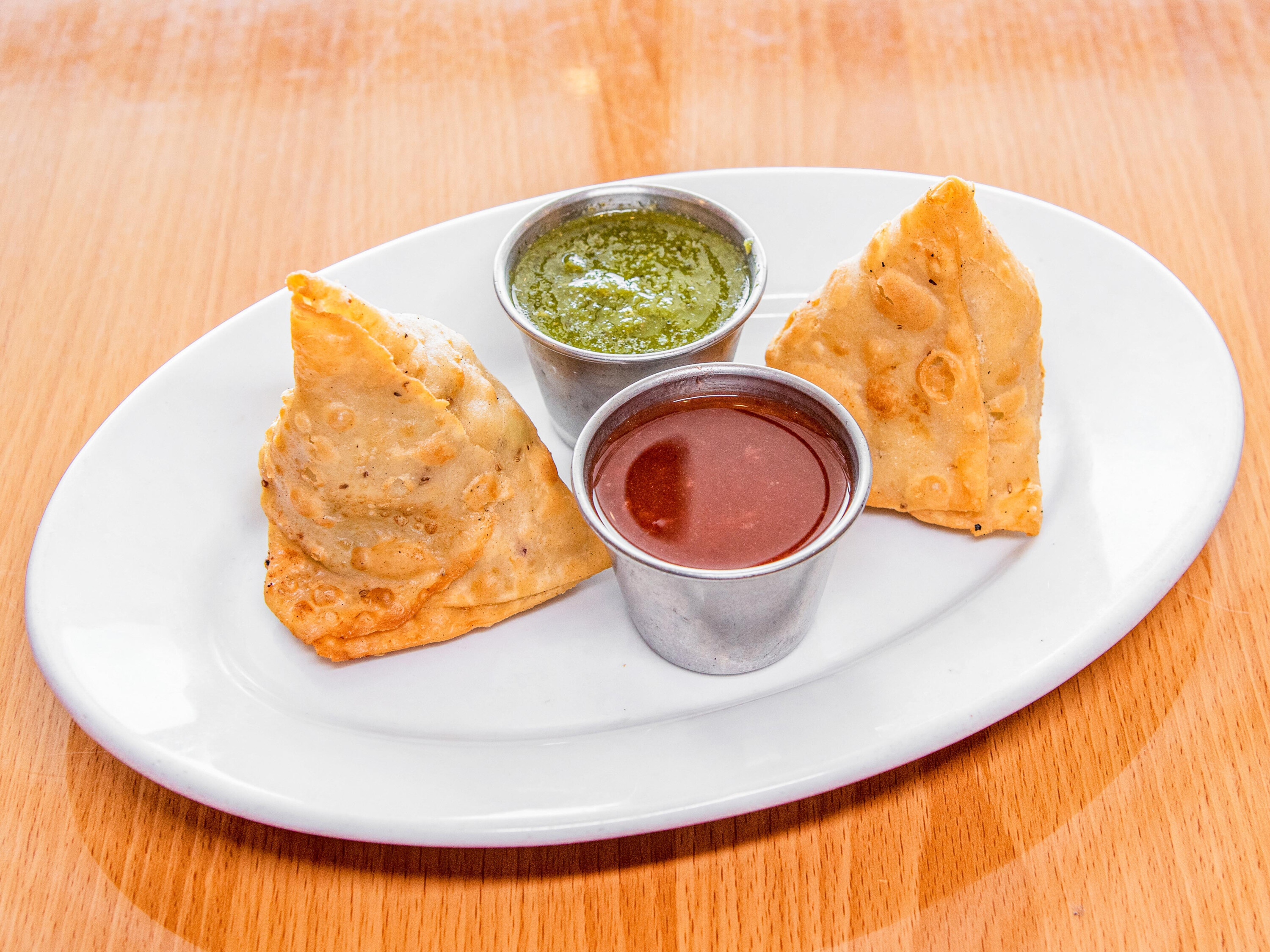 Order 2. Two Pieces Vegetable Samosa food online from India House Restaurant store, Michigan City on bringmethat.com